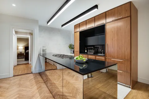 a kitchen with stainless steel appliances a stove and a refrigerator