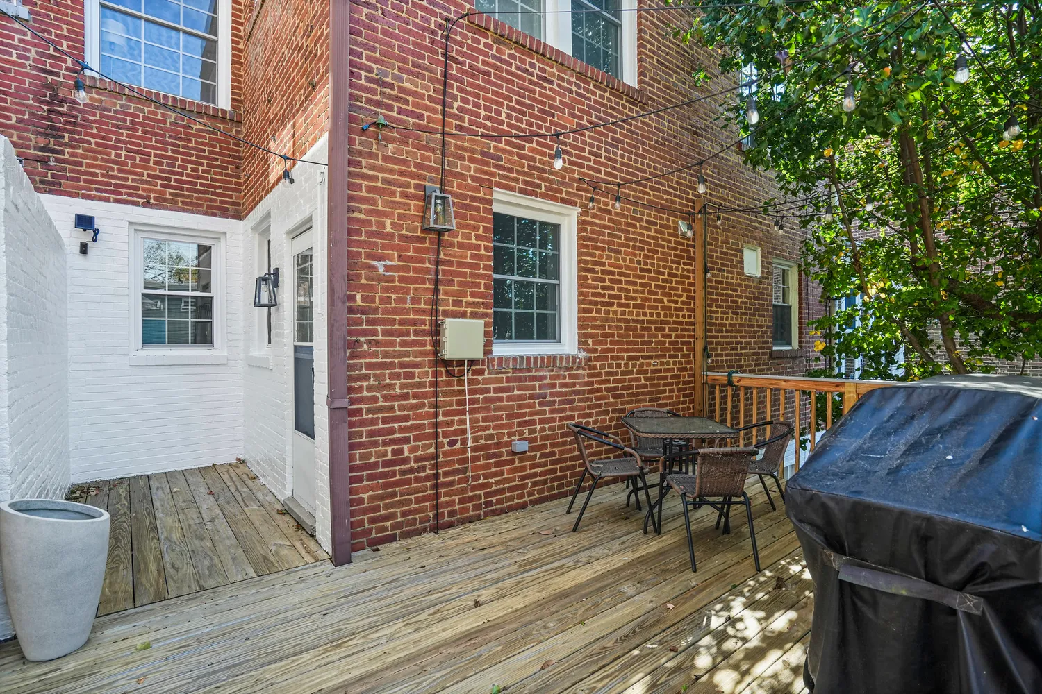 a kitchen with granite countertop a stove a sink and a microwave