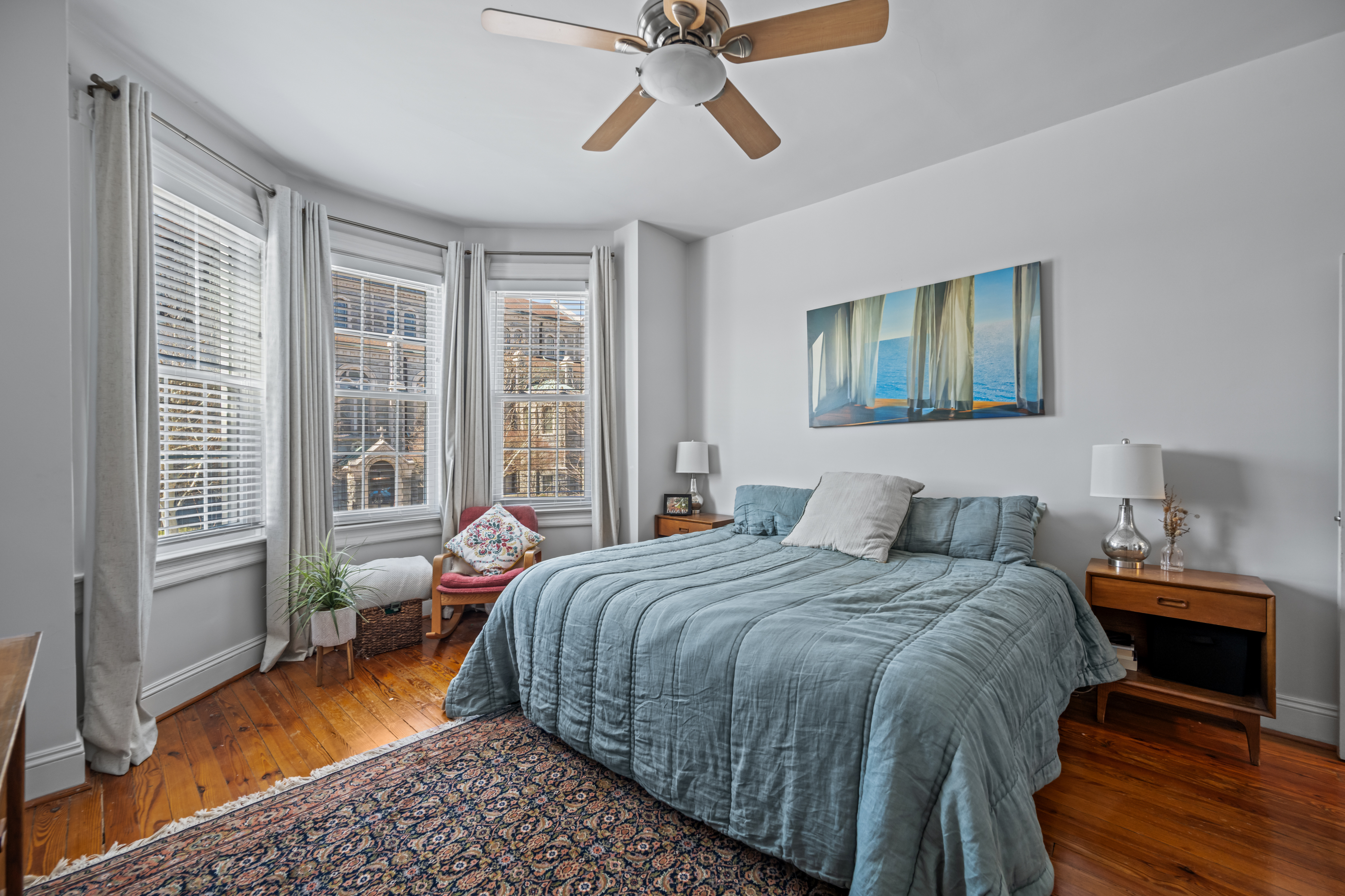 633 South Conkling Street Baltimore, MD 21224 - Photo 10 of 23 a bedroom with a bed and wooden floor