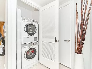 2351 Adam Clayton Powell Jr Boulevard, Unit 306 Manhattan, NY 10030 - Photo 5 of 13 a view of storage and utility room with washer and dryer