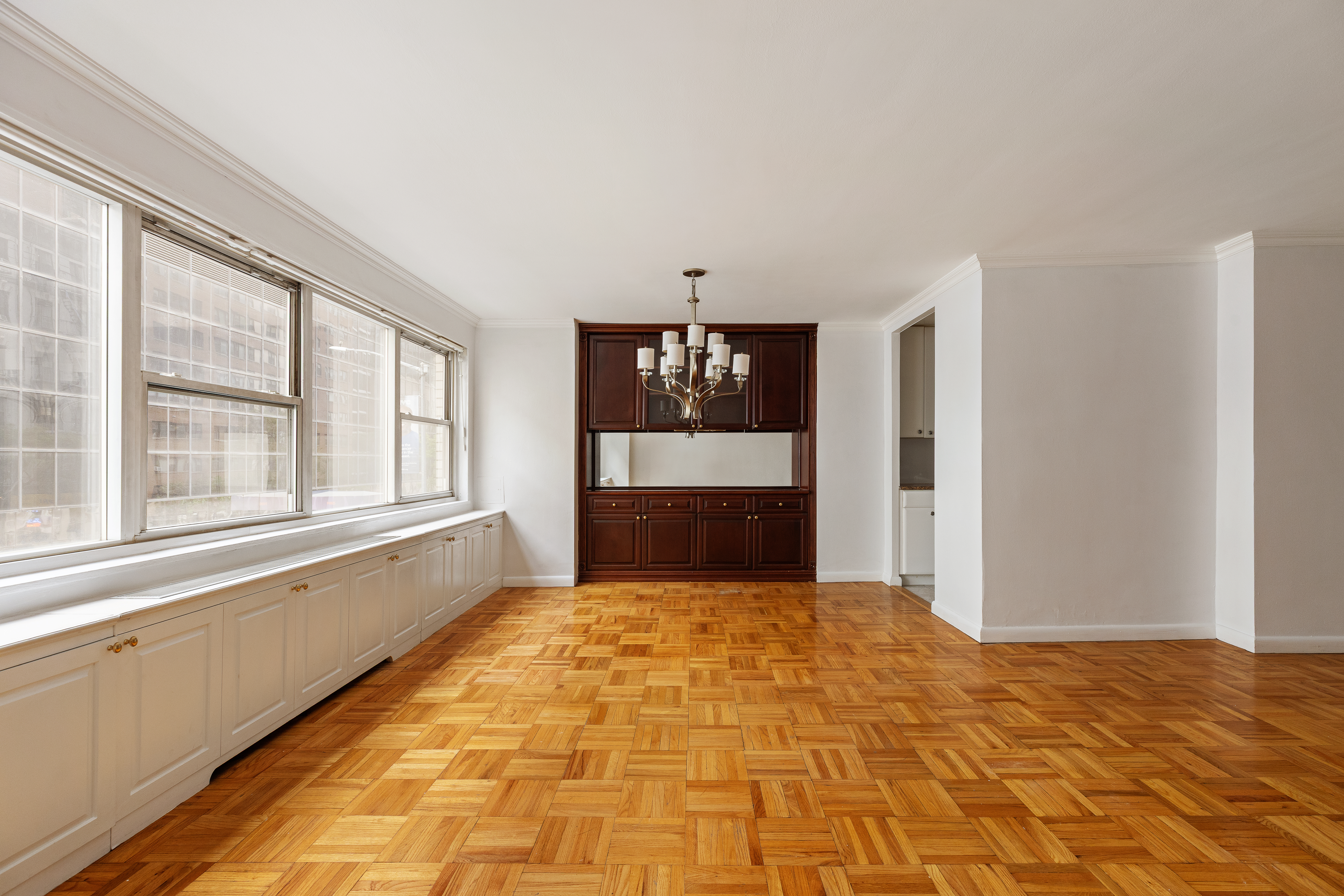 201 East 66th Street, Unit 2E Manhattan, NY 10065 - Photo 3 of 15 a view of an empty room with a window