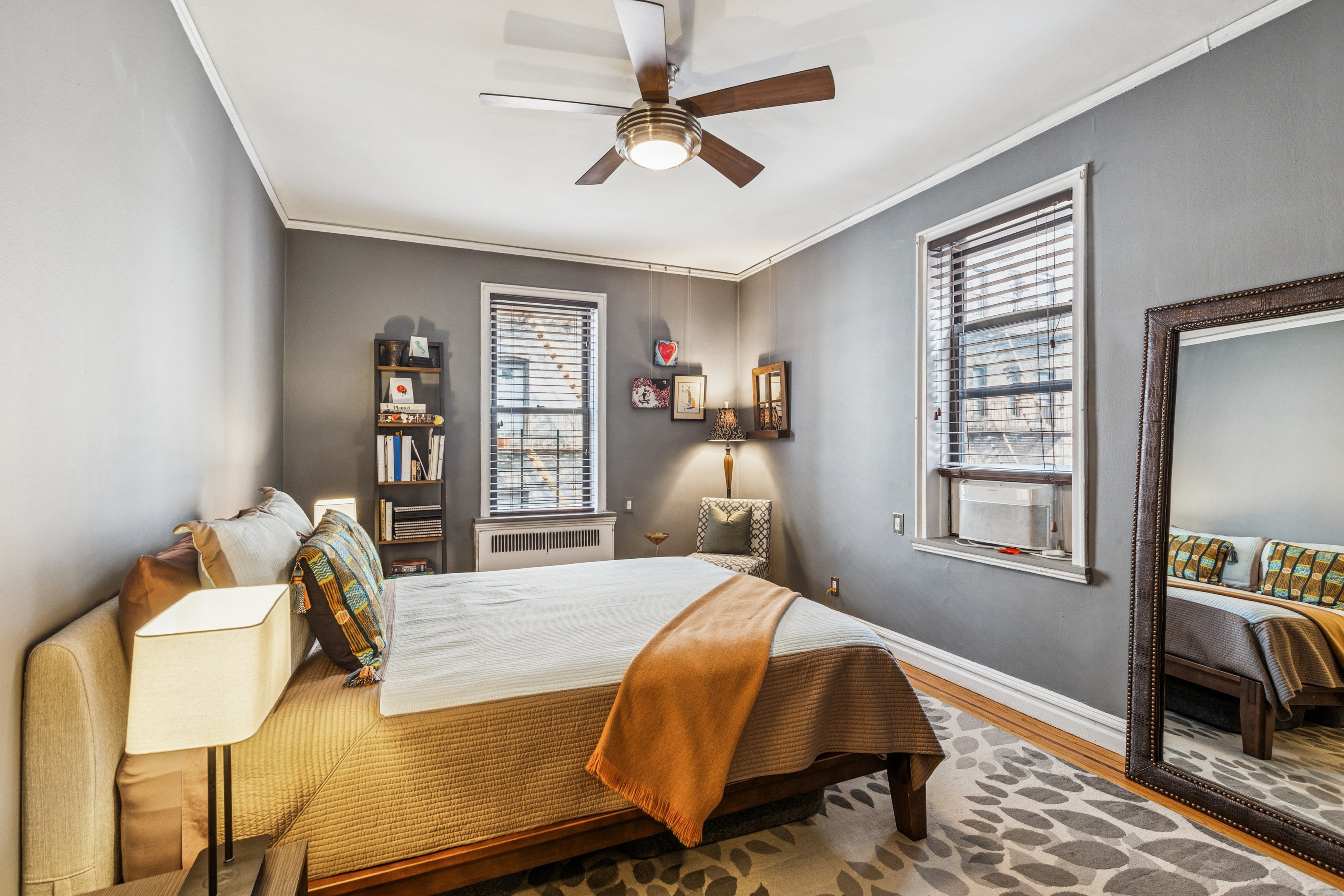 60 Cooper Street, Unit 5J Manhattan, NY 10034 - Photo 6 of 17 a bedroom with a bed and wooden floor