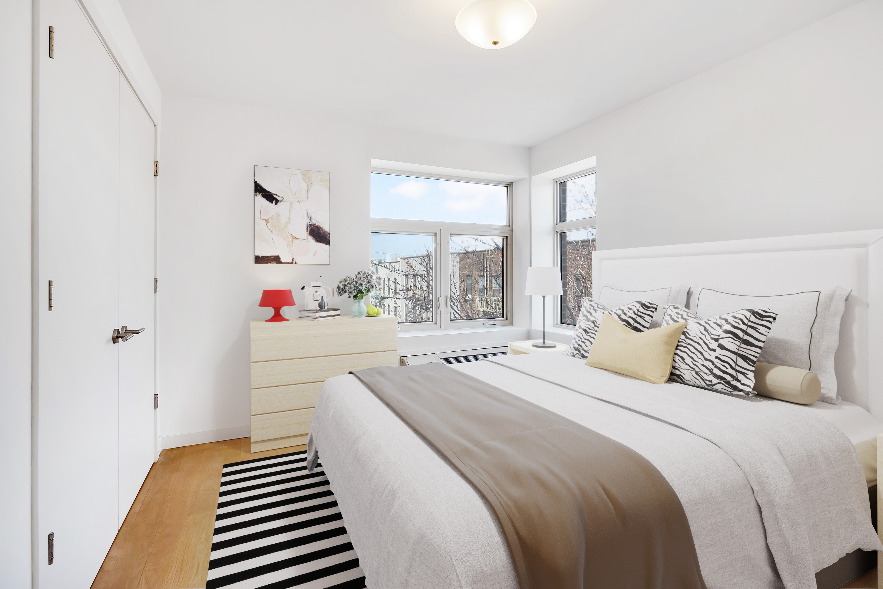 26-20 14th Place, Unit 3D Queens, NY 11102 - Photo 5 of 12 a bedroom with a bed and window