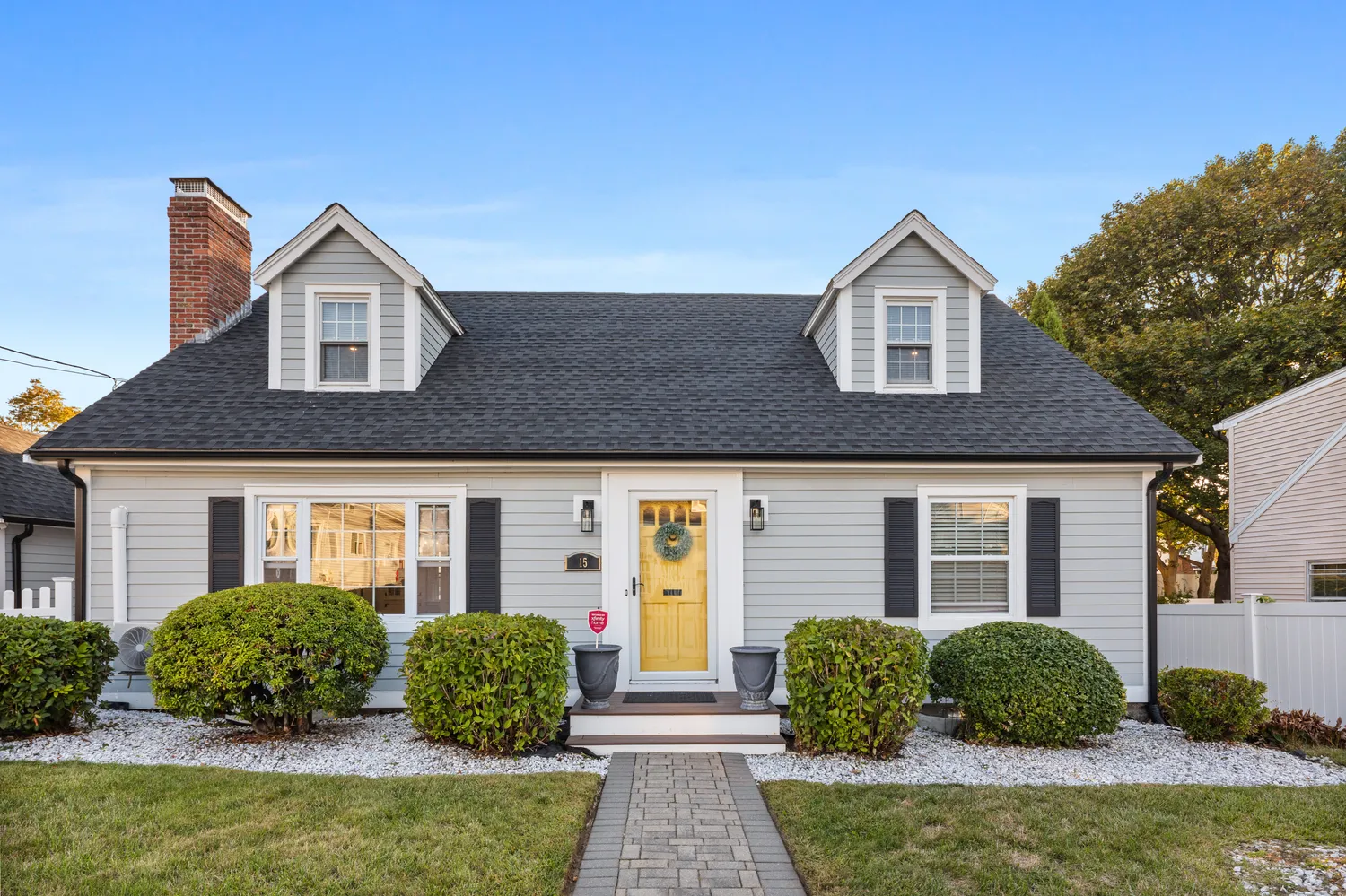 a front view of a house with garden