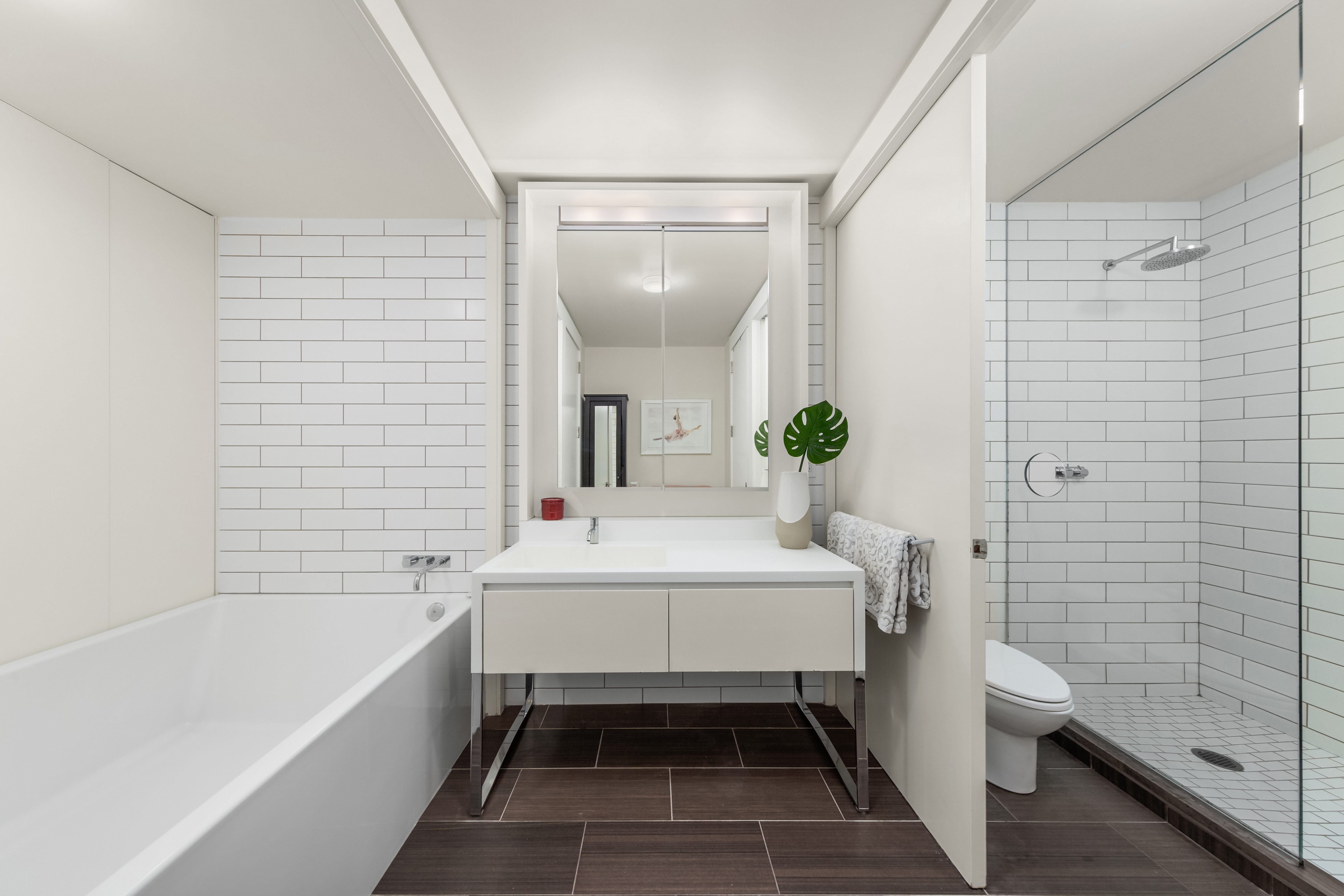 15 William Street, Unit 7B Manhattan, NY 10005 - Photo 6 of 9 a bathroom with a sink a toilet and shower