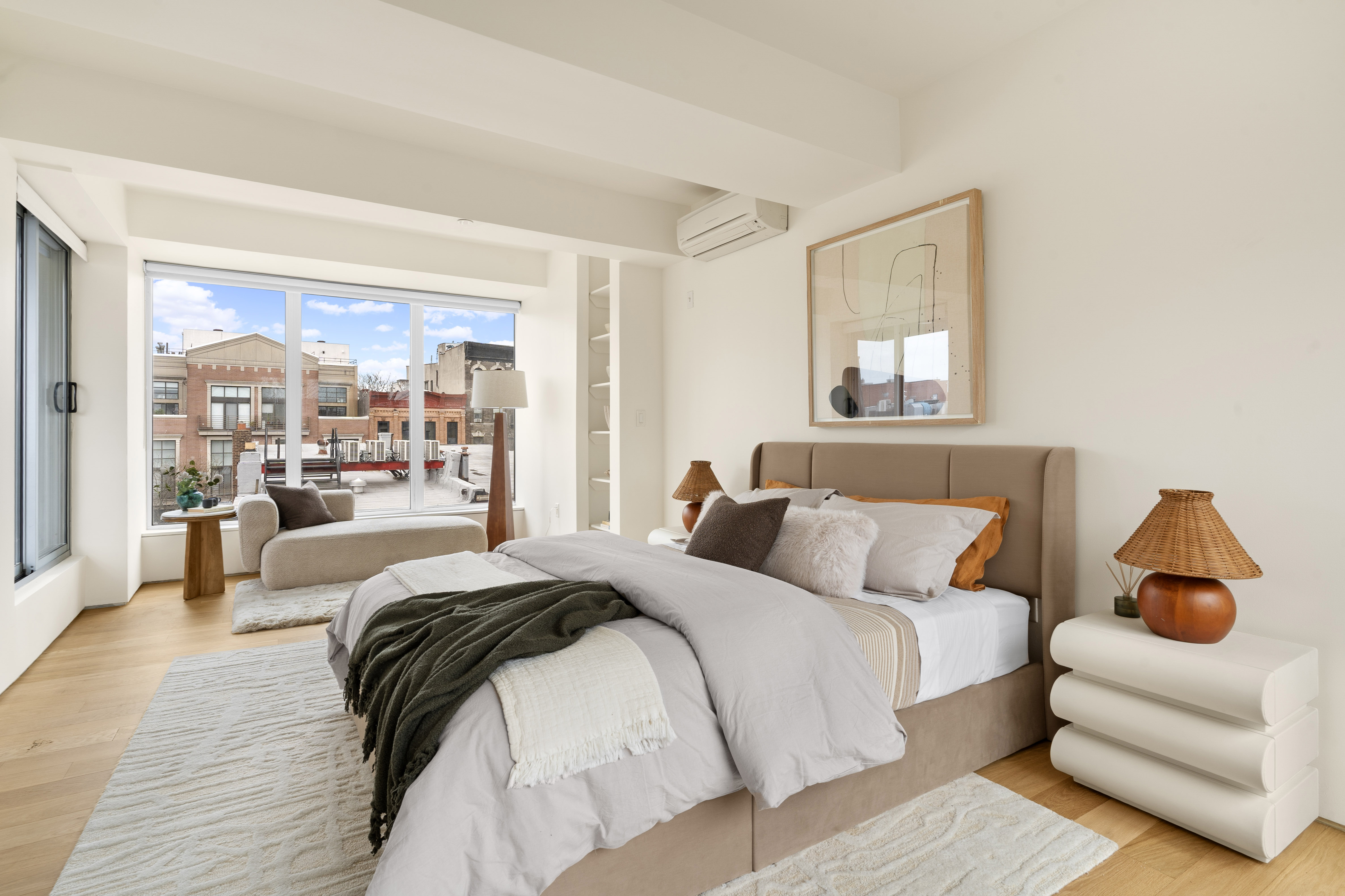 142 North 1st Street, Unit PH Brooklyn, NY 11249 - Photo 8 of 15 a bedroom with a large bed and a couch
