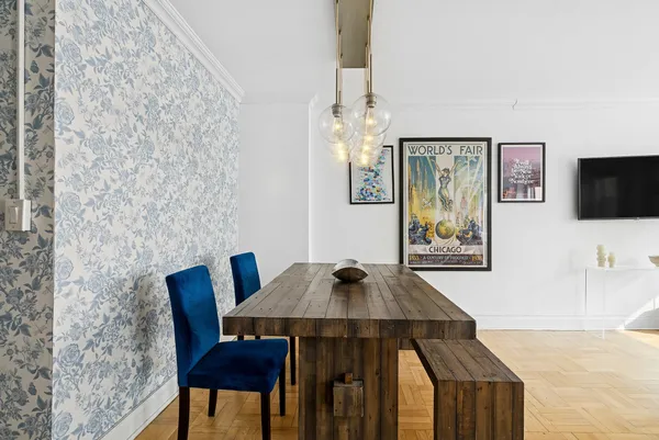 a view of a dining room with furniture and wooden floor