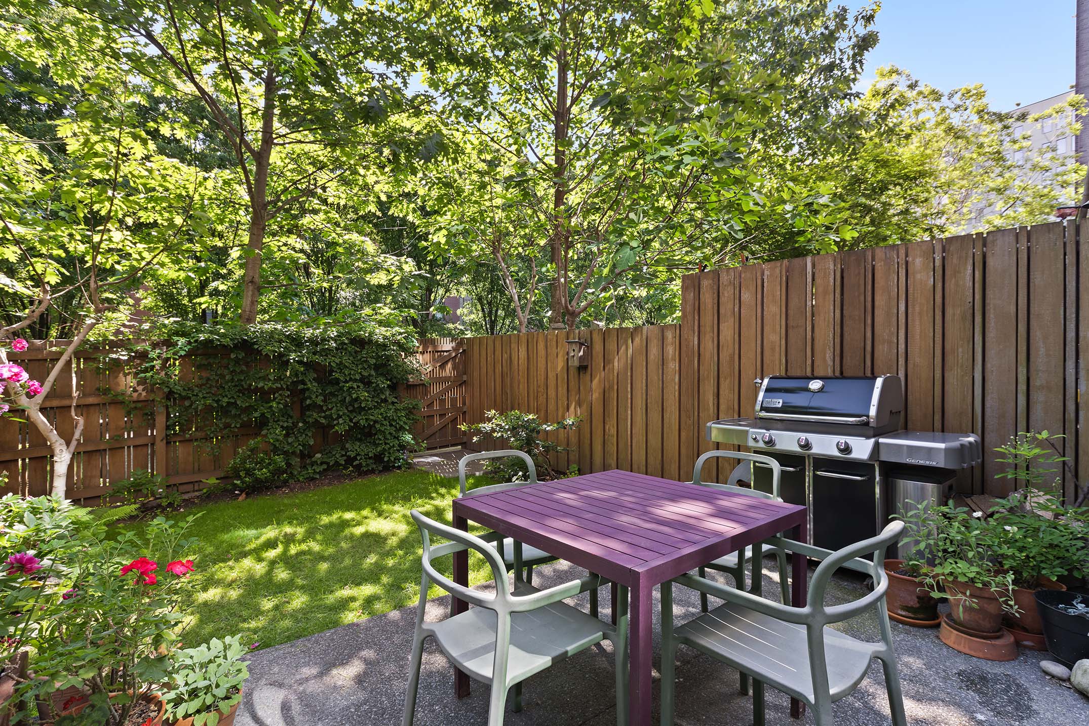 27 Clermont Avenue Brooklyn, NY 11205 - Photo 7 of 19 a backyard of a house with table and chairs