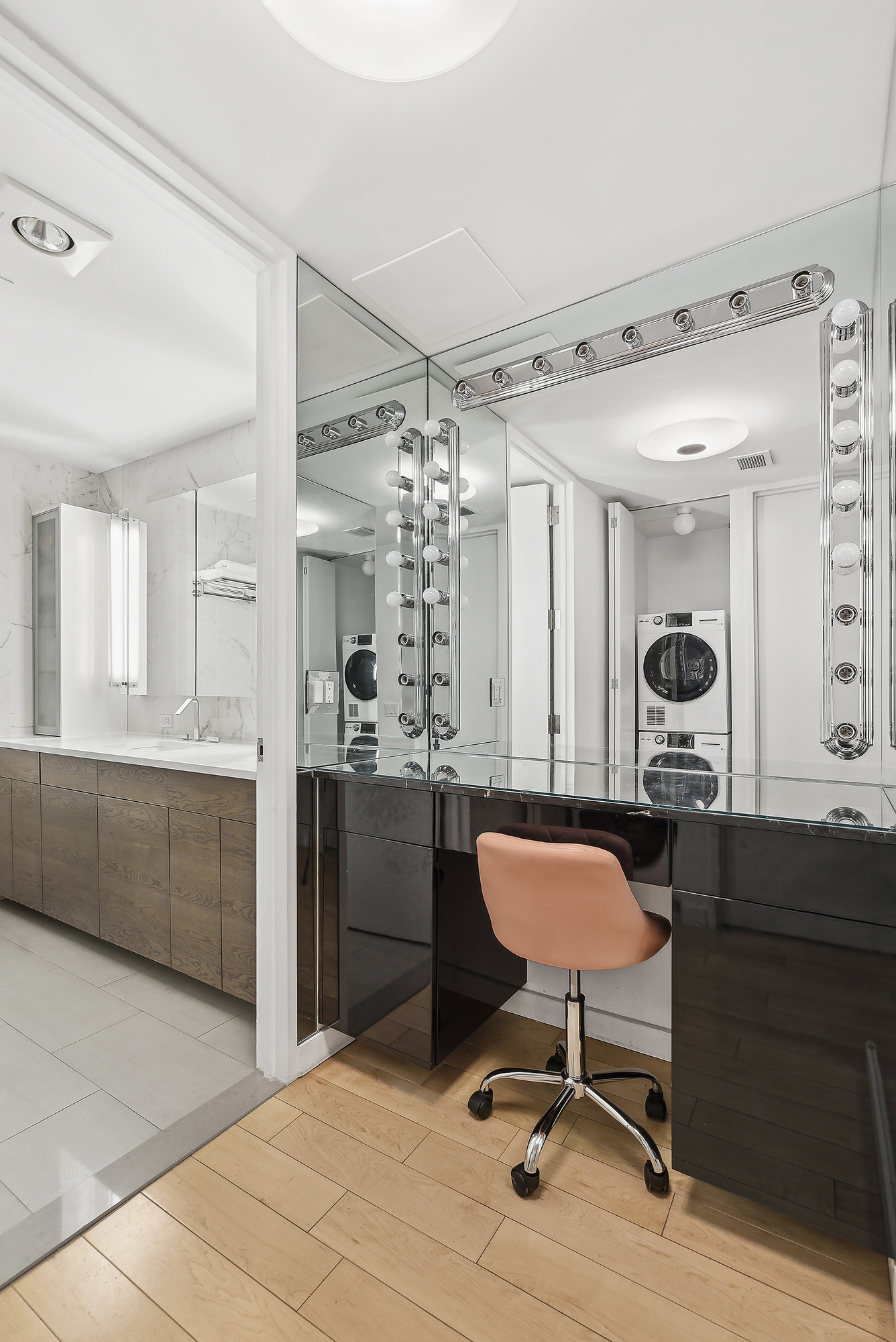 641 5th Avenue, Unit 28B Manhattan, NY 10022 - Photo 9 of 12 a view of a kitchen with a table and chairs