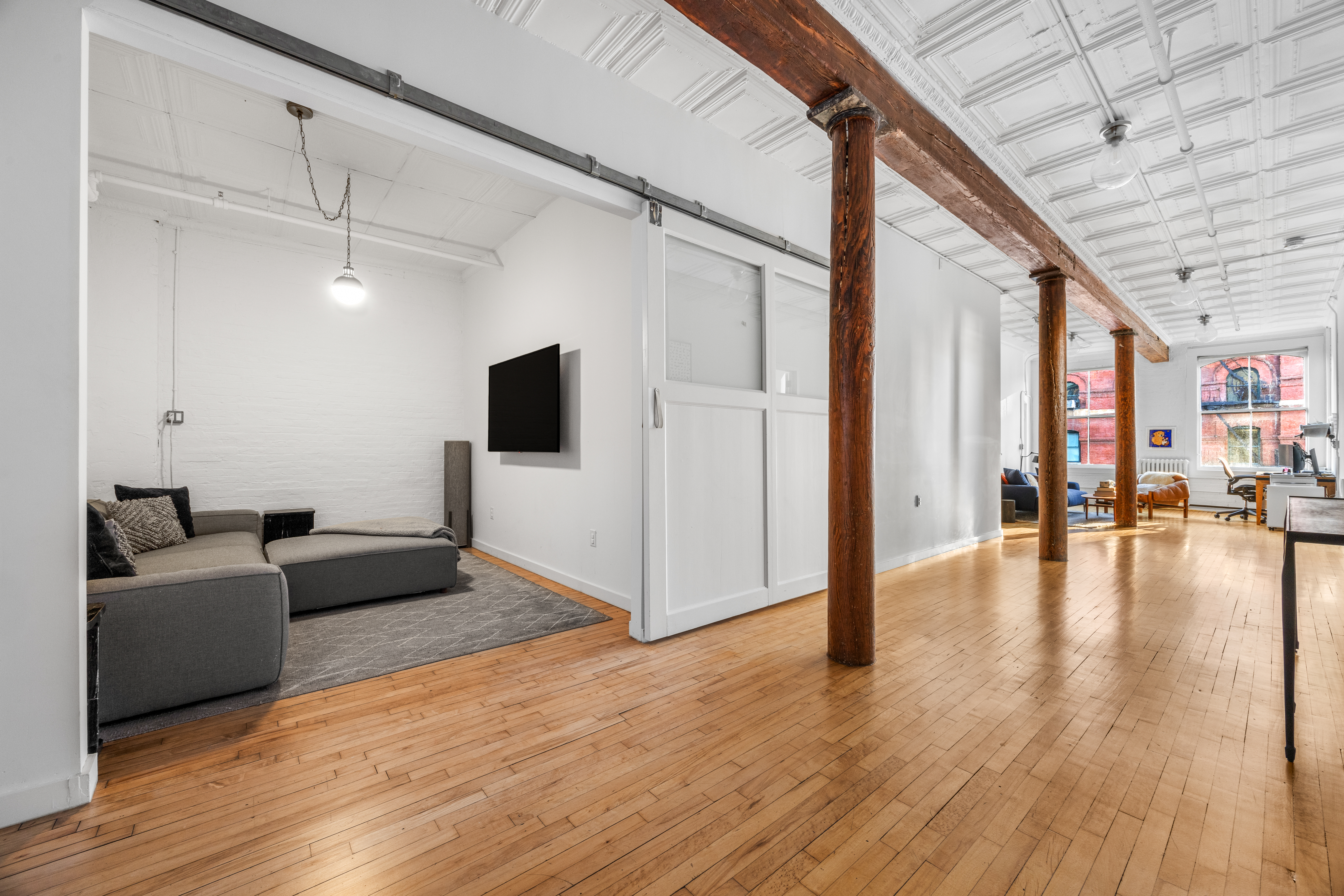 5 White Street, Unit 5B Manhattan, NY 10013 - Photo 11 of 21 a living room with furniture and a flat screen tv