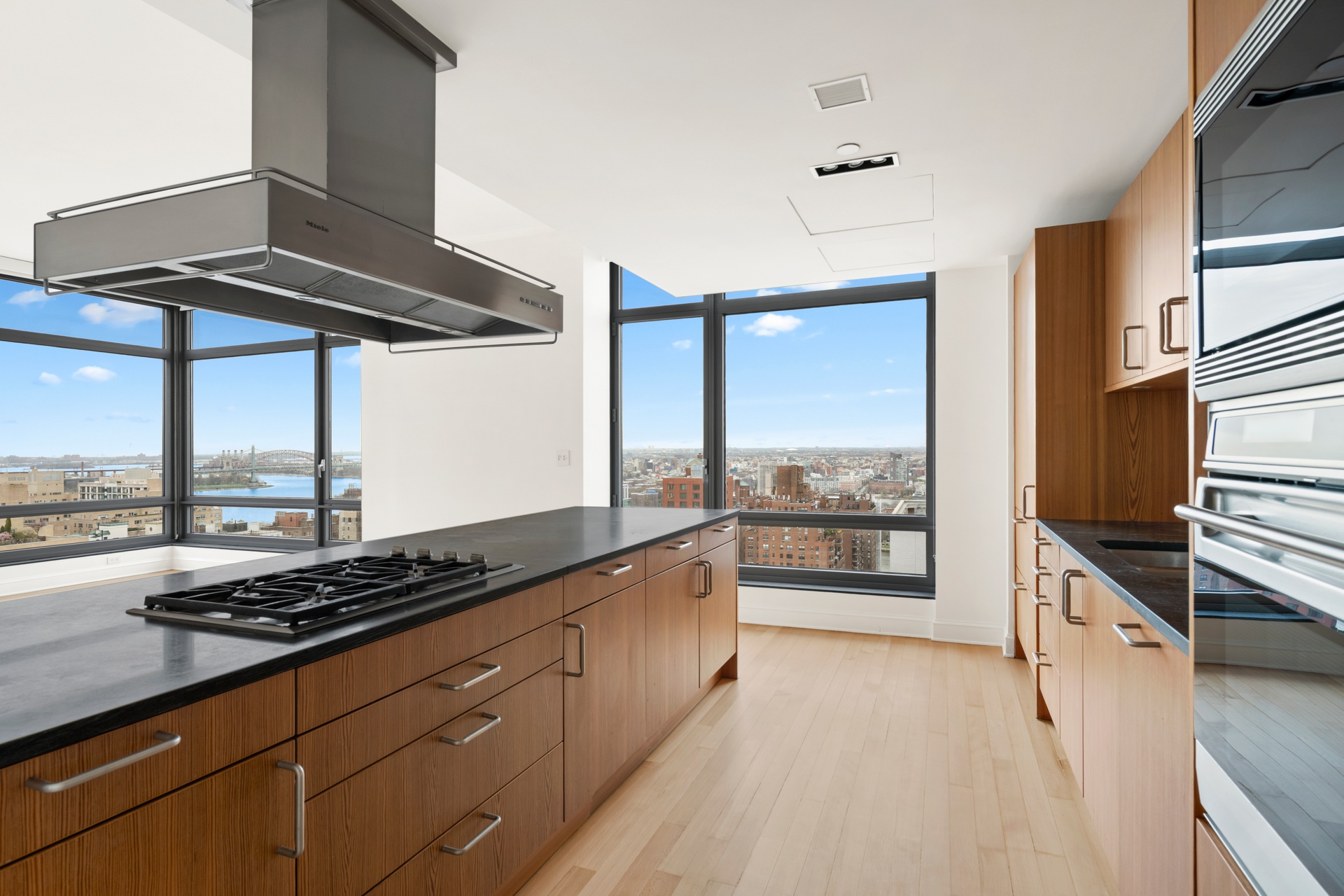 450 East 83rd Street, Unit 23B Manhattan, NY 10028 - Photo 6 of 18 a kitchen with stainless steel appliances a stove and a refrigerator