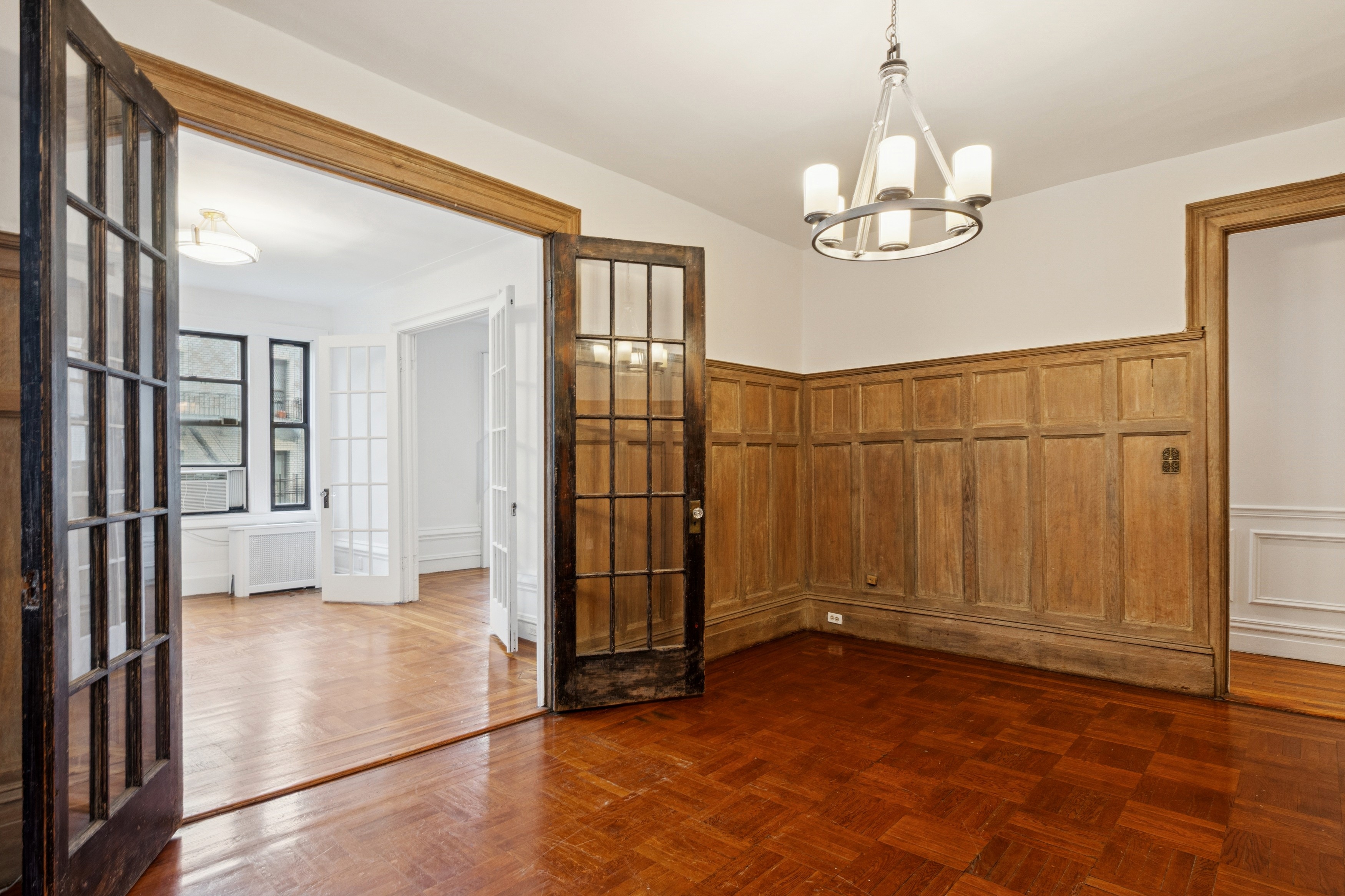 804 West 180th Street, Unit 41 Manhattan, NY 10033 - Photo 9 of 23 a view of a hallway with wooden floor and staircase