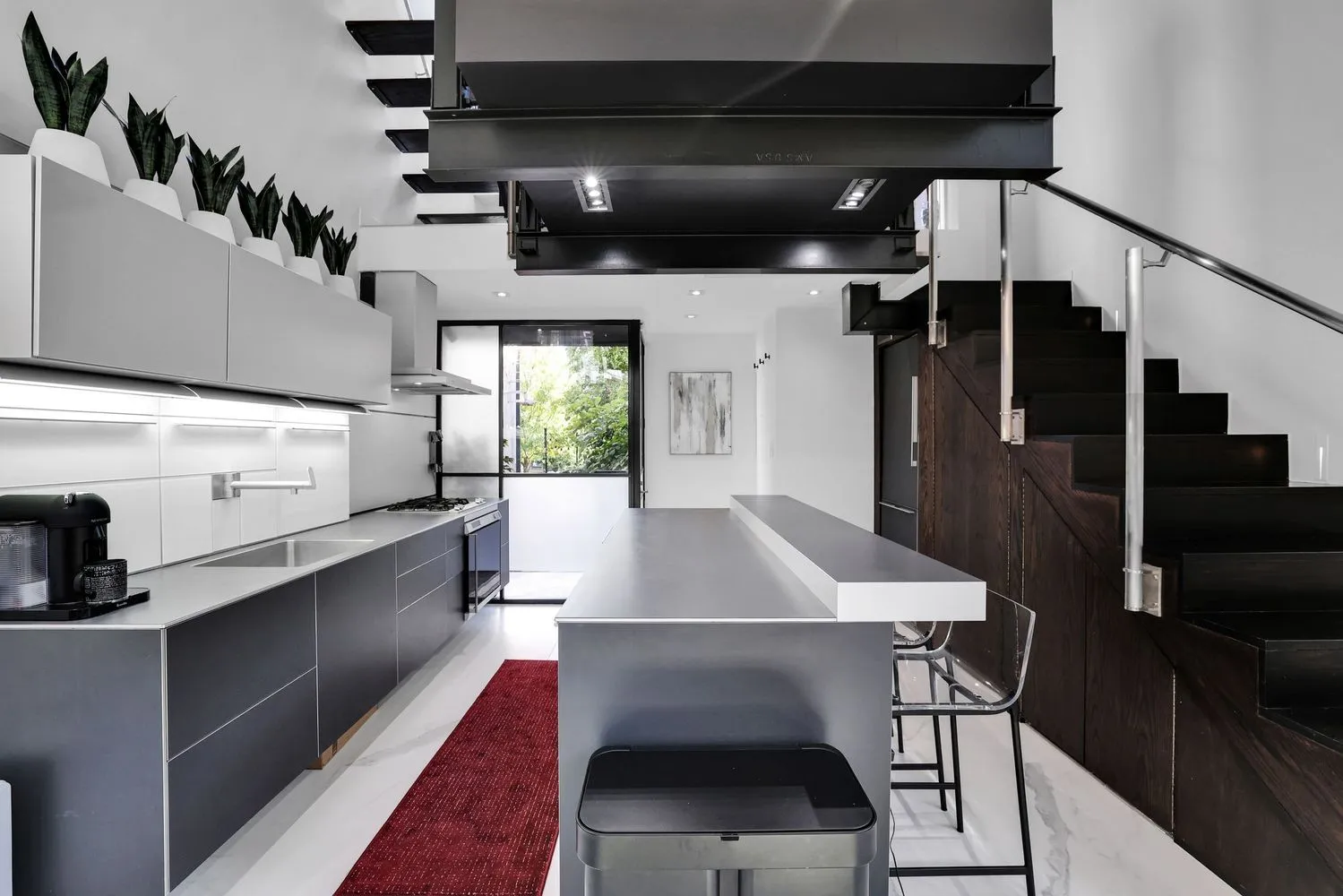 a view of a room with shelves and wooden floor