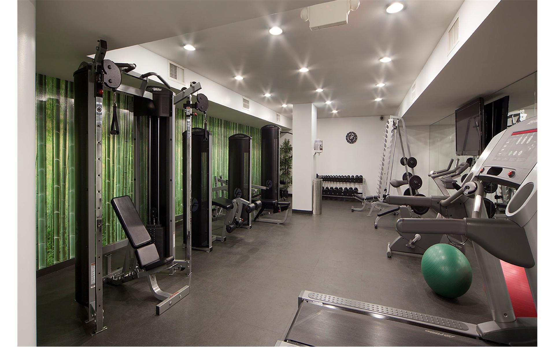 100 West 58th Street, Unit 8H Manhattan, NY 10019 - Photo 7 of 8 a view of a room with gym equipment