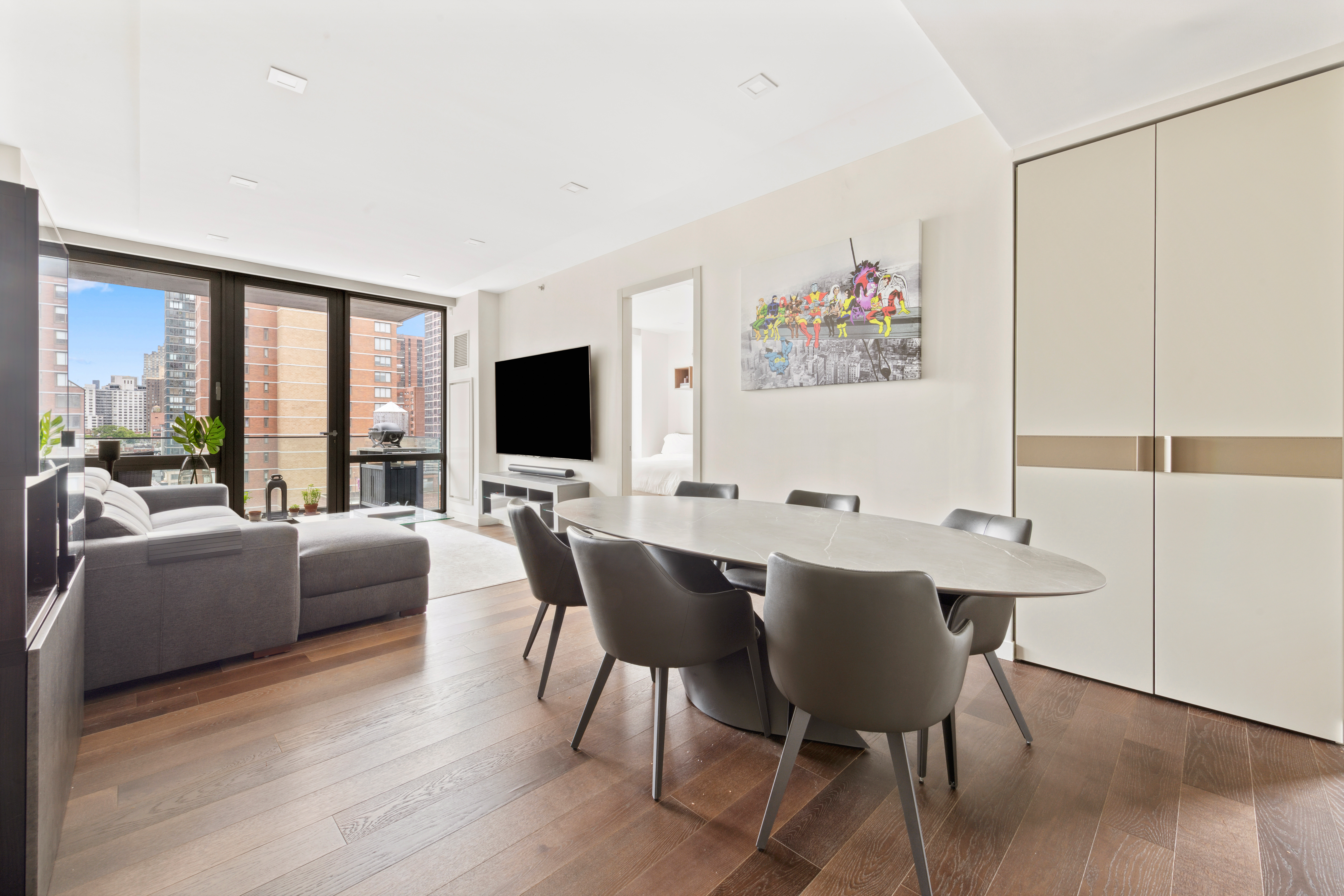 302 East 96th Street, Unit 1302 Manhattan, NY 10128 - Photo 2 of 17 a view of a dining room with furniture window and outside view