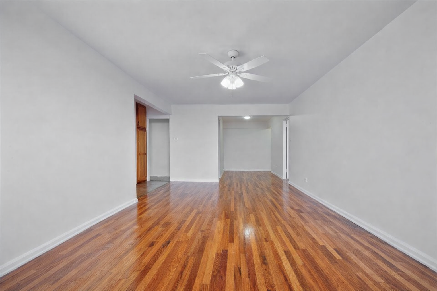 1270 East 51st Street, Unit 6X Brooklyn, NY 11234 - Photo 7 of 17 wooden floor in an empty room with a window