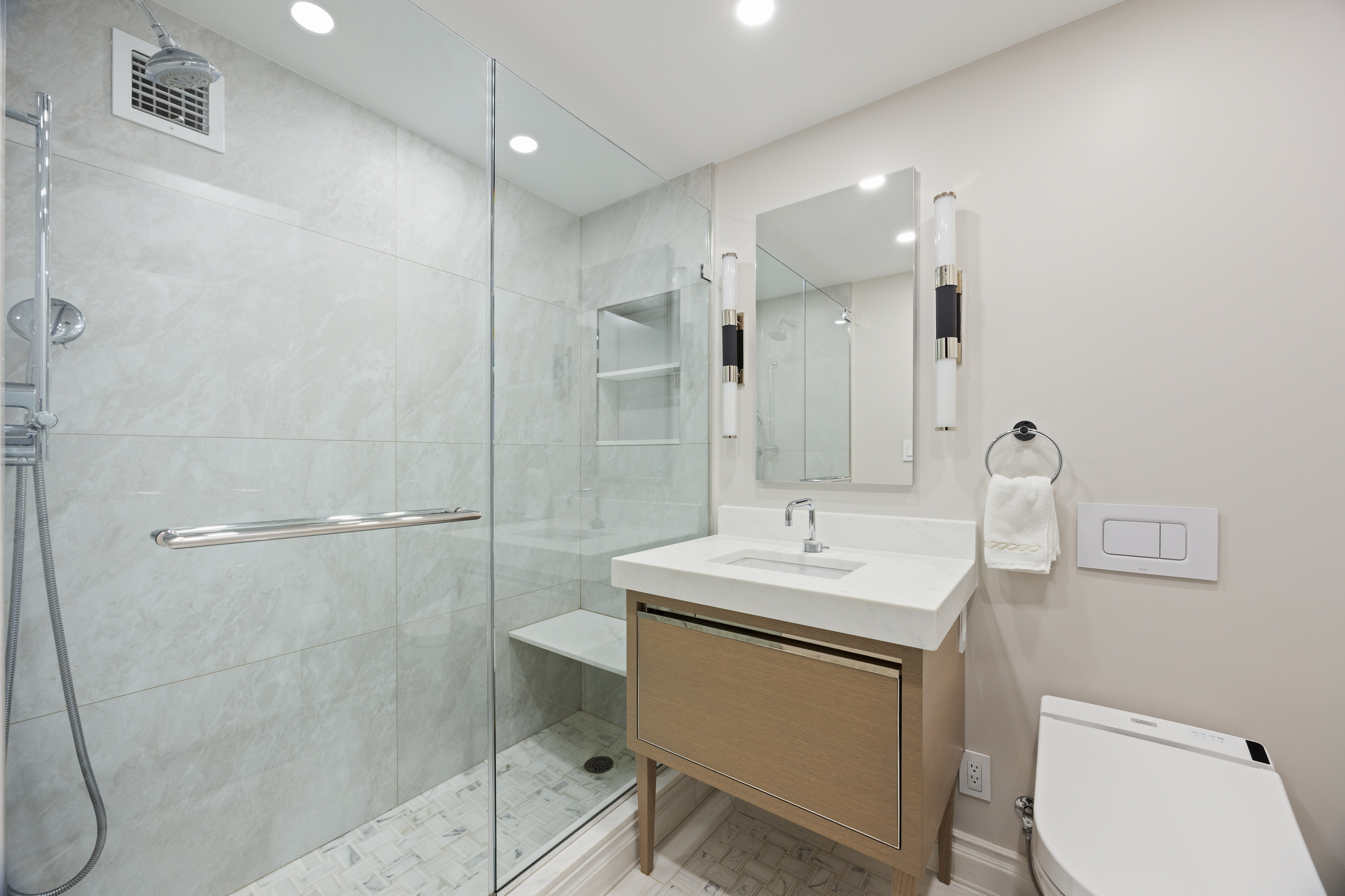 470 West 24th Street, Unit 9J Manhattan, NY 10011 - Photo 9 of 13 a bathroom with a sink toilet and shower