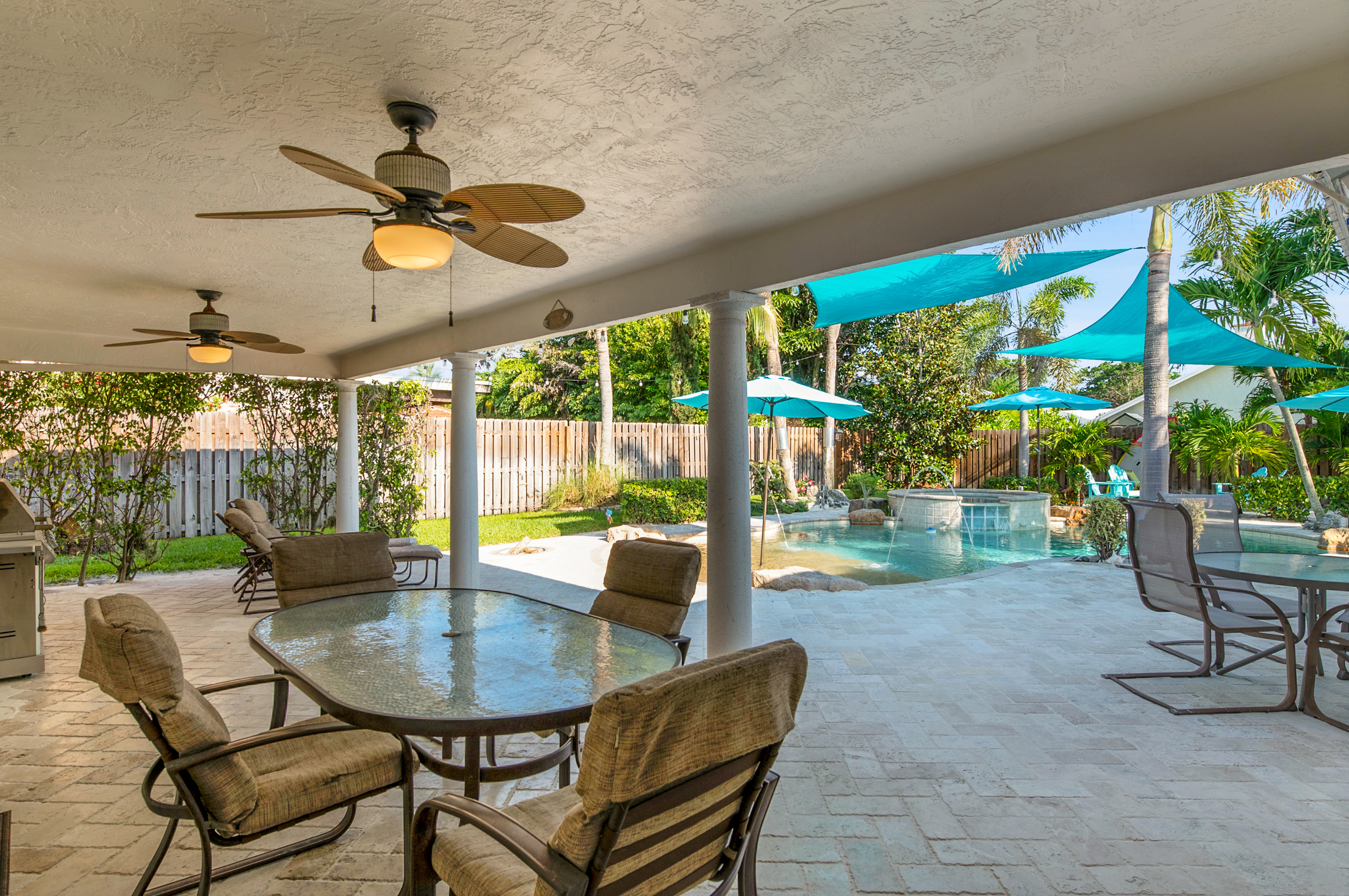 1560 Southwest 16th Street Boca Raton, FL 33486 - Photo 24 of 72 a dining room with furniture and a floor to ceiling window