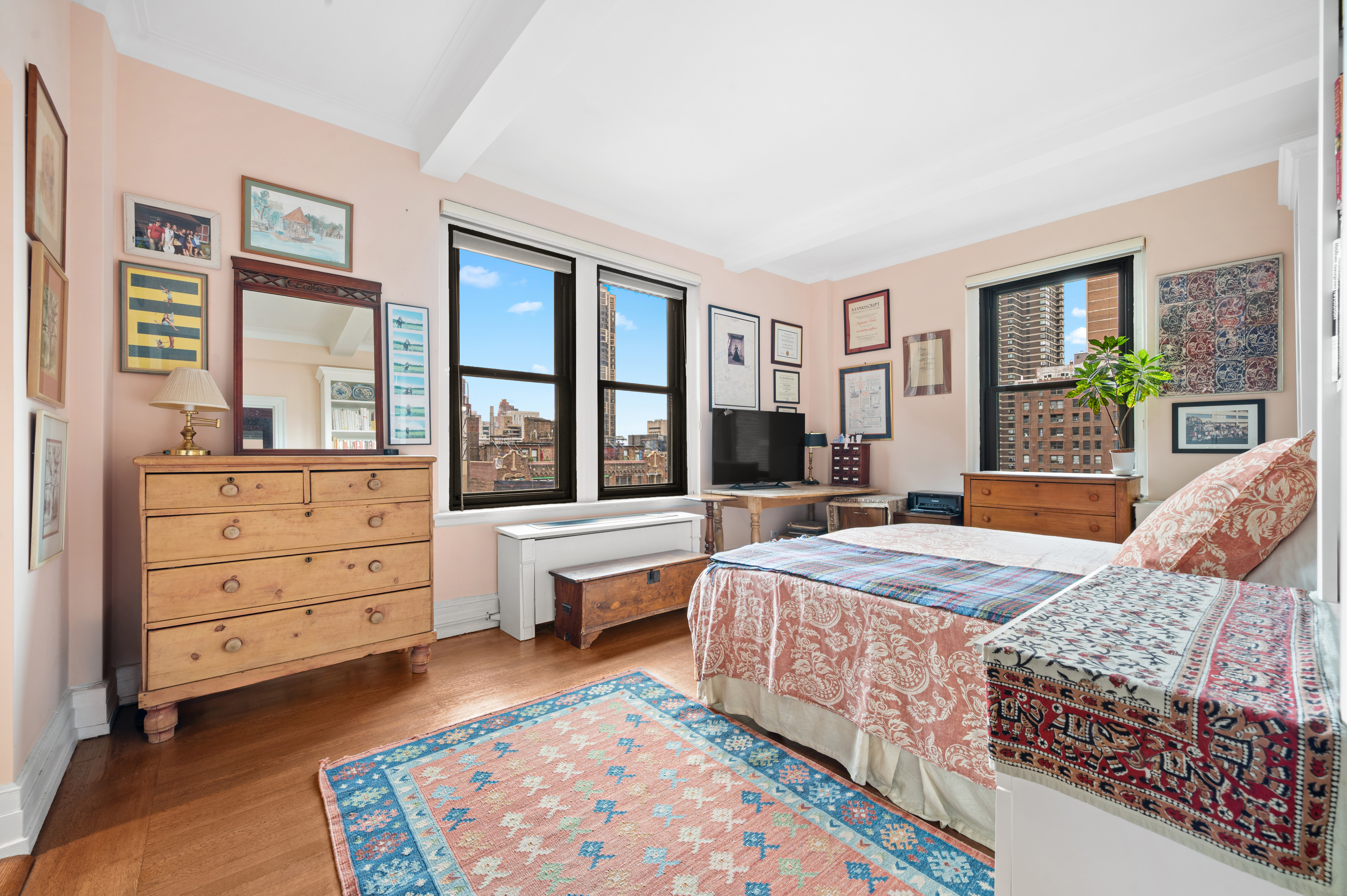 325 East 57th Street, Unit 11D Manhattan, NY 10022 - Photo 7 of 13 a bed room with a bed and a window