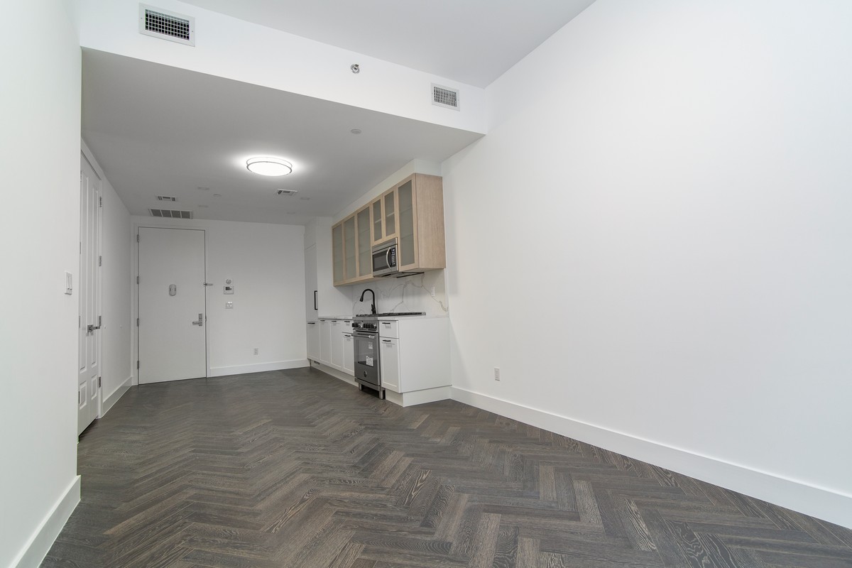 11-12 44th Drive, Unit 2B Queens, NY 11101 - Photo 7 of 15 a view of empty room