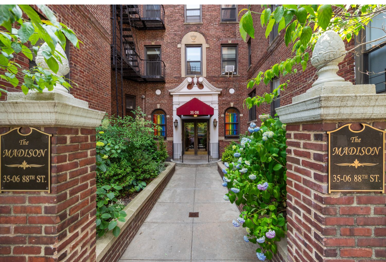 35-06 88th Street, Unit 5DD Queens, NY 11372 - Photo 18 of 18 a front view of a house with plants and entryway
