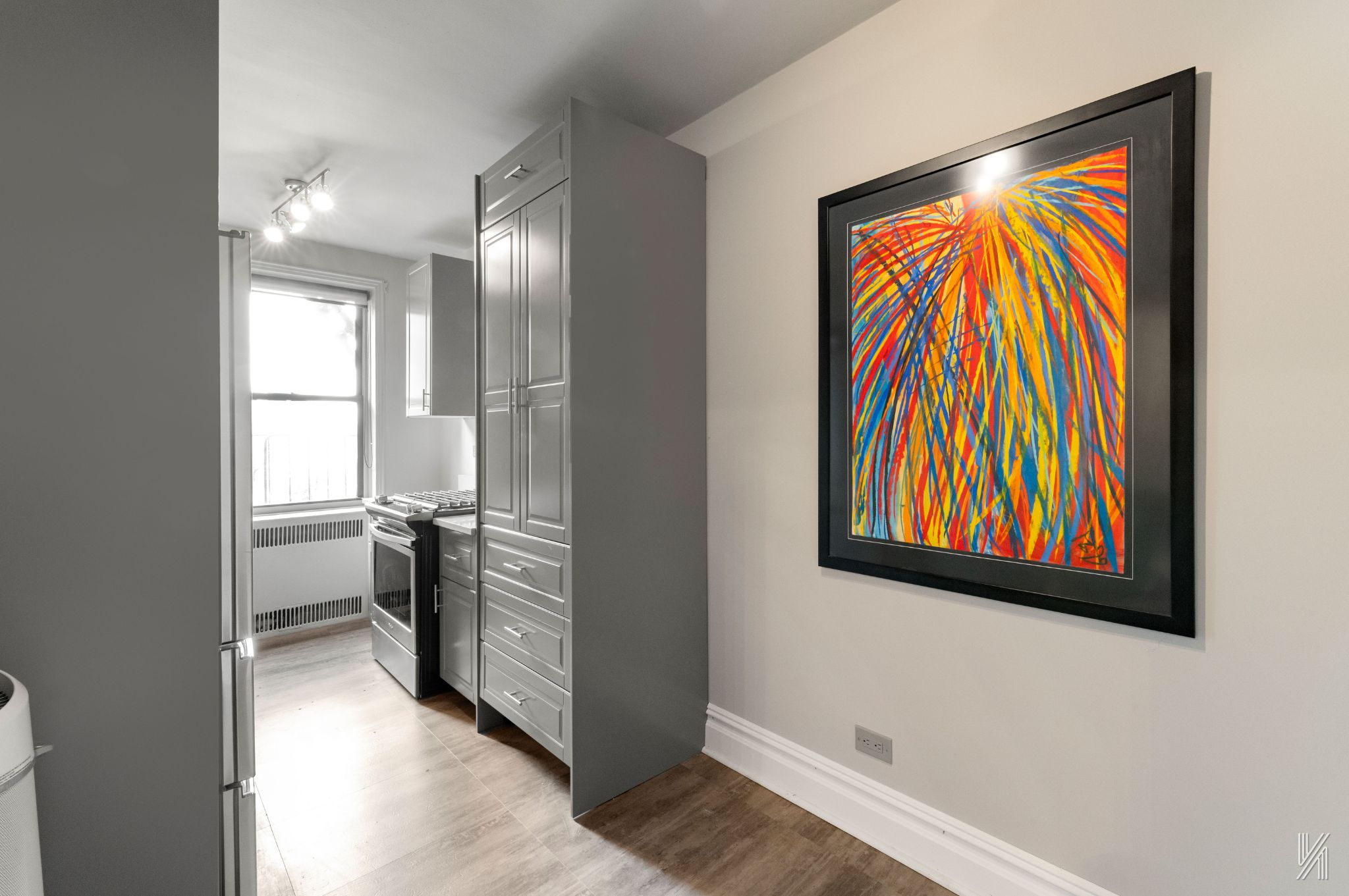 25-40 31st Avenue, Unit 6F Queens, NY 11106 - Photo 8 of 19 a view of front door with wooden floor