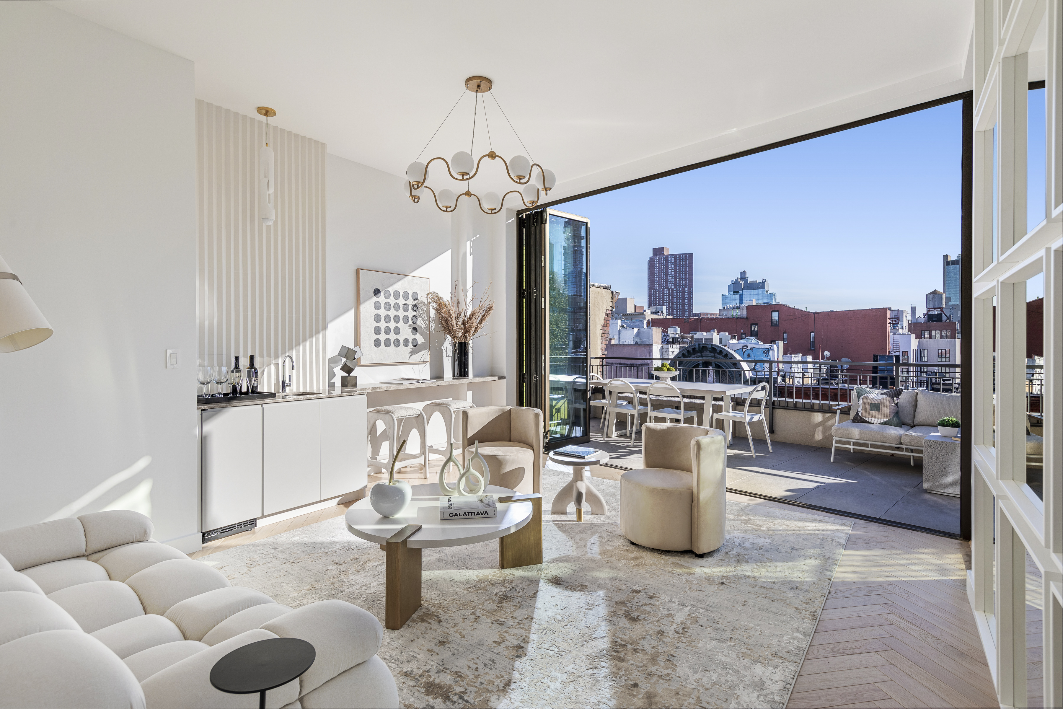 378 Broome Street, Unit PH Manhattan, NY 10013 - Photo 3 of 25 a room with lots of white furniture and a chandelier