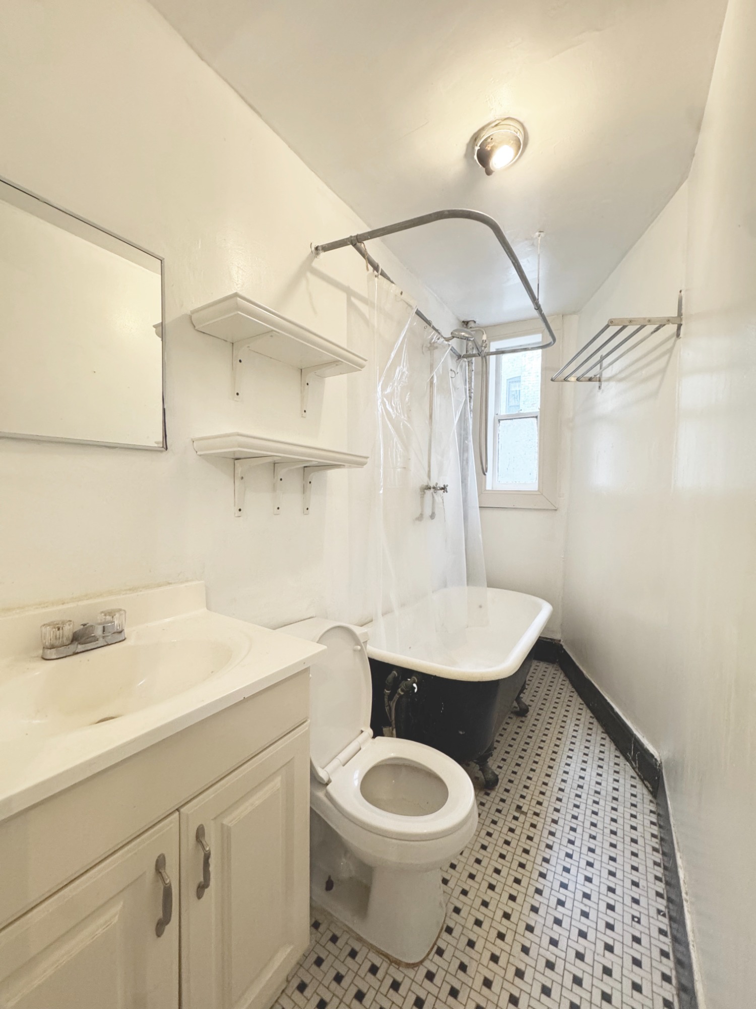 562 7th Street, Unit 3 Brooklyn, NY 11215 - Photo 6 of 6 a bathroom with a sink a toilet and shower