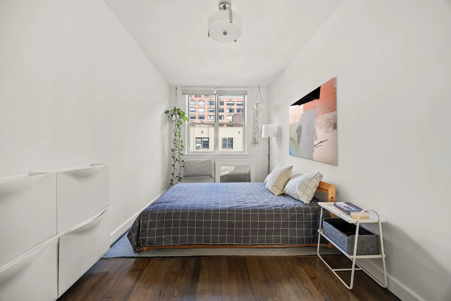 a bedroom with bed and window