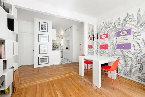 a spacious bedroom with a bed closet and wall painting