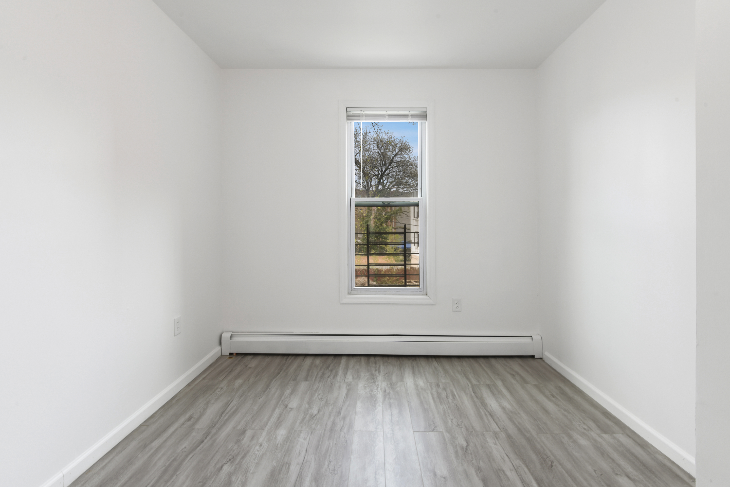 332 East 198th Street, Unit 2 Bronx, NY 10458 - Photo 5 of 10 an empty room with a window