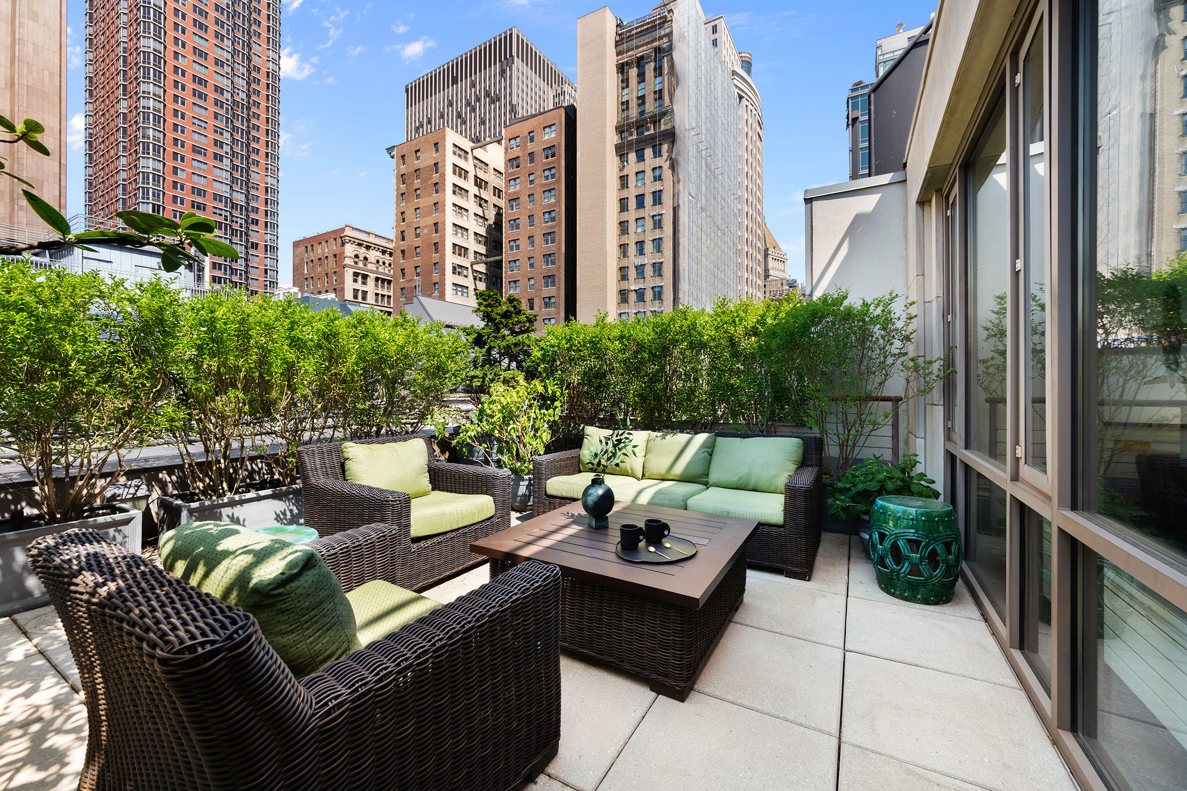 77 Reade Street, Unit PHA Manhattan, NY 10007 - Photo 11 of 12 a view of a patio with couches table and chairs and potted plants