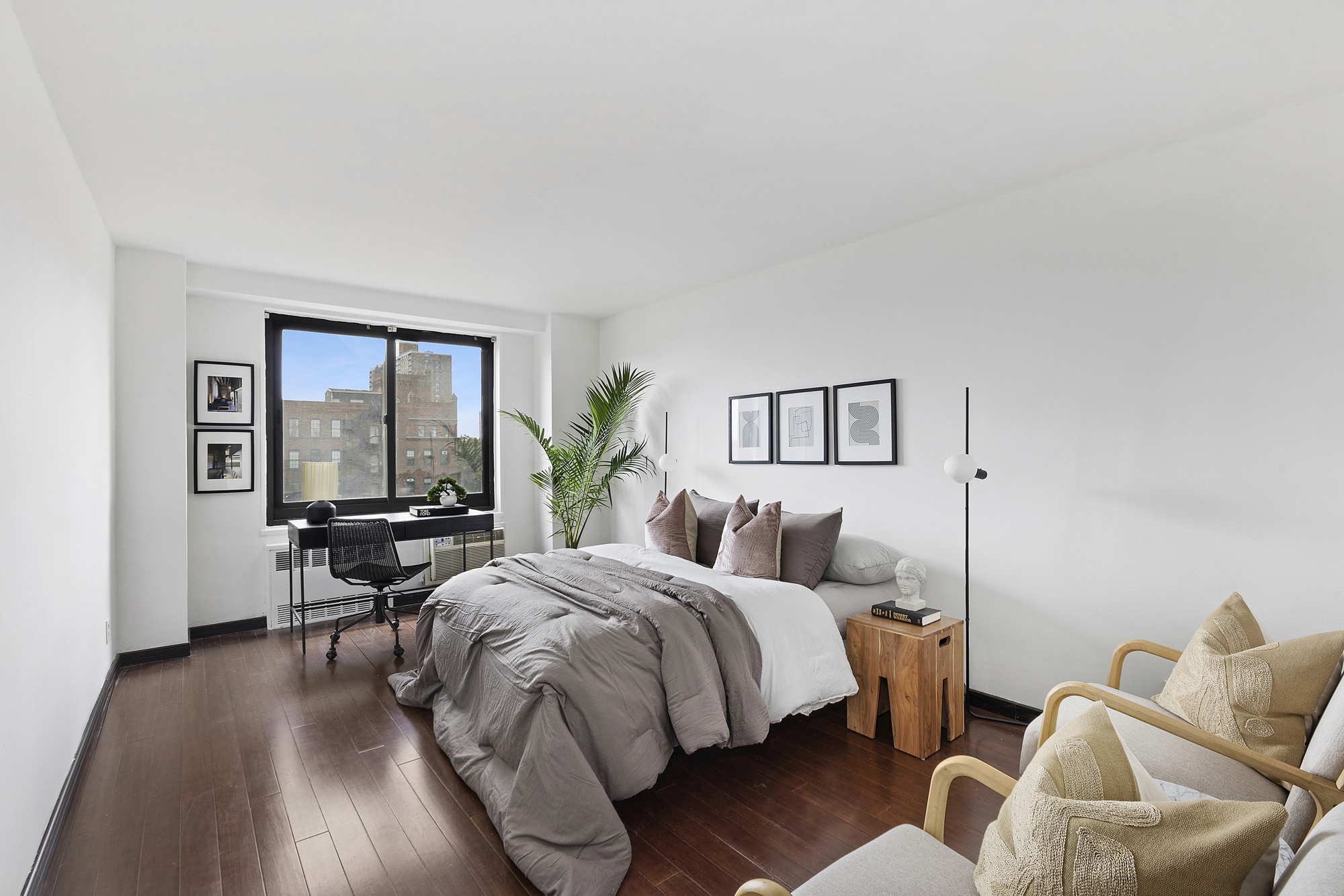 195 Willoughby Avenue, Unit 905 Brooklyn, NY 11205 - Photo 2 of 7 a bedroom with two beds and a large window