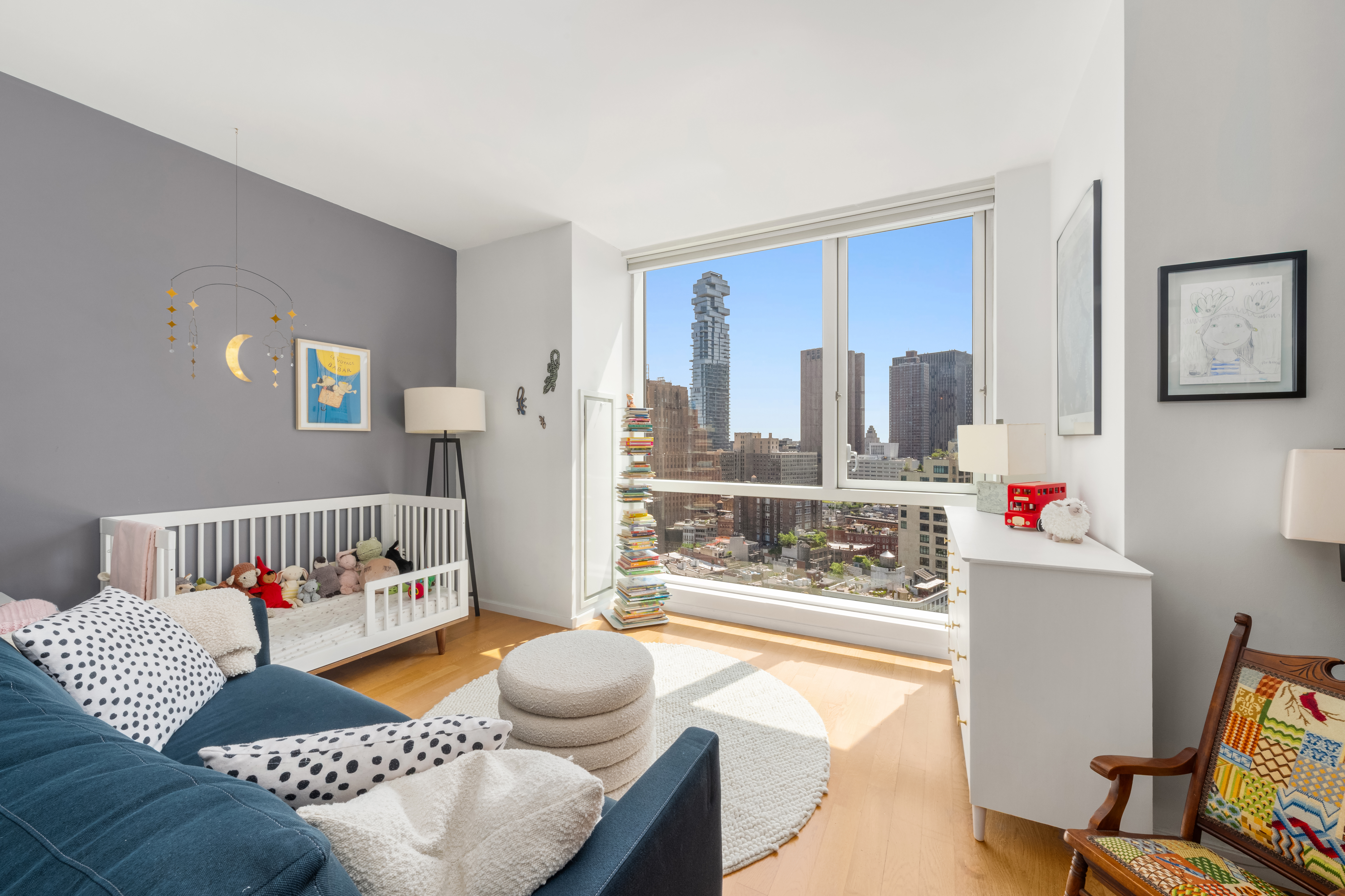 200 Chambers Street, Unit 25F Manhattan, NY 10007 - Photo 11 of 14 a living room with furniture and a table