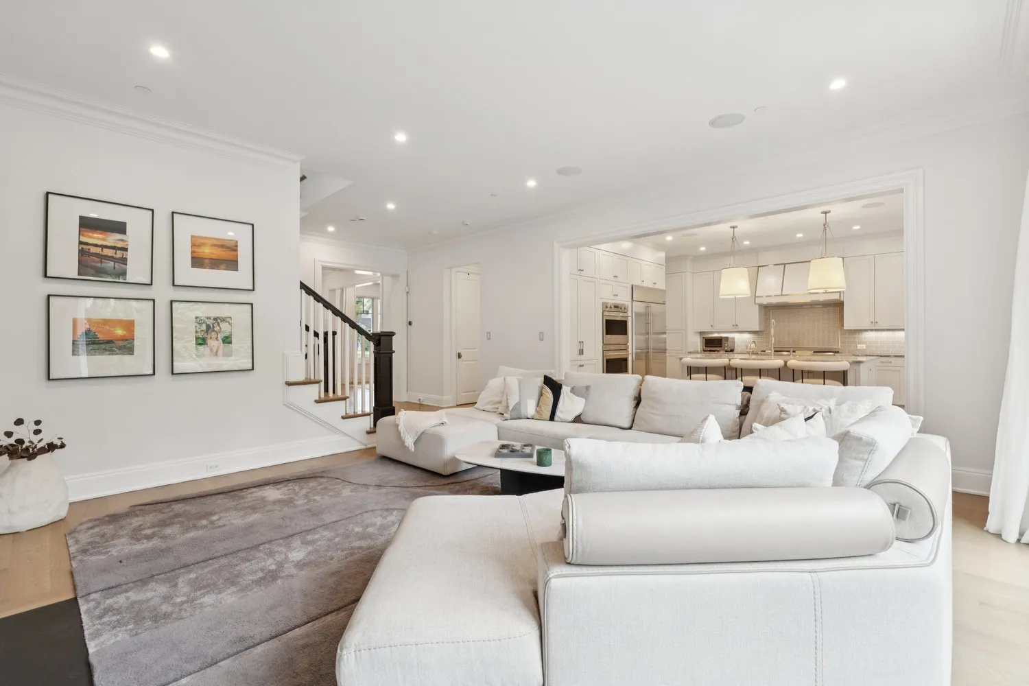 a bedroom with a large bed couch and a large window