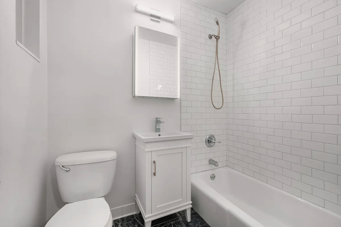 151 West 80th Street, Unit 4F Manhattan, NY 10024 - Photo 6 of 8 a bathroom with a toilet sink and bathtub