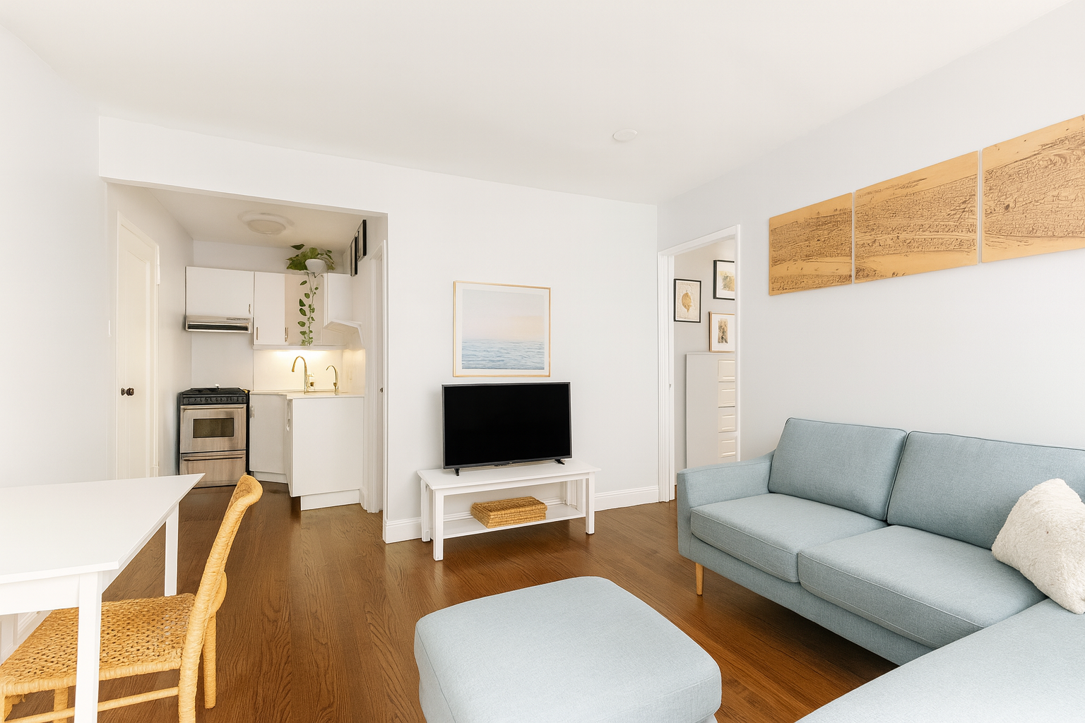 60 East 9th Street, Unit 512 Manhattan, NY 10003 - Photo 2 of 5 a living room with furniture and a flat screen tv