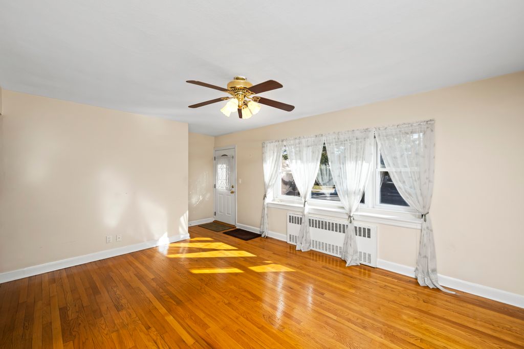 522 Stewart Avenue Staten Island, NY 10314 - Photo 7 of 33 a view of a bedroom with a sink and cabinet