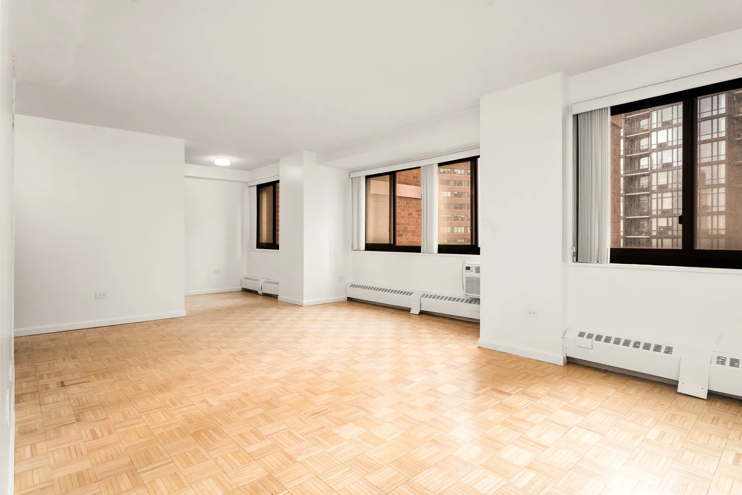 a view of an empty room with a window