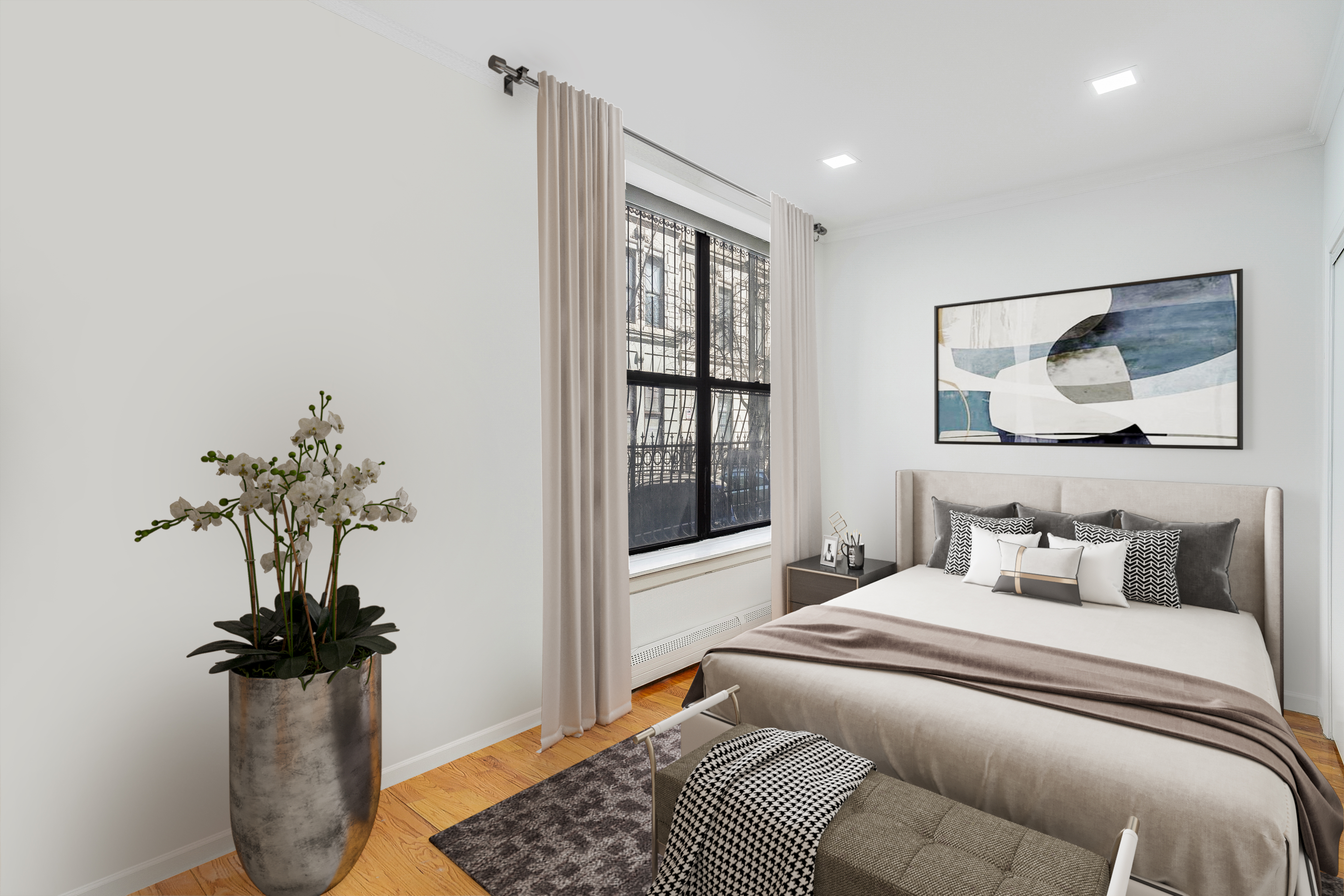 220 West 111th Street, Unit 1A Manhattan, NY 10026 - Photo 4 of 10 a bedroom with a bed and a potted plant