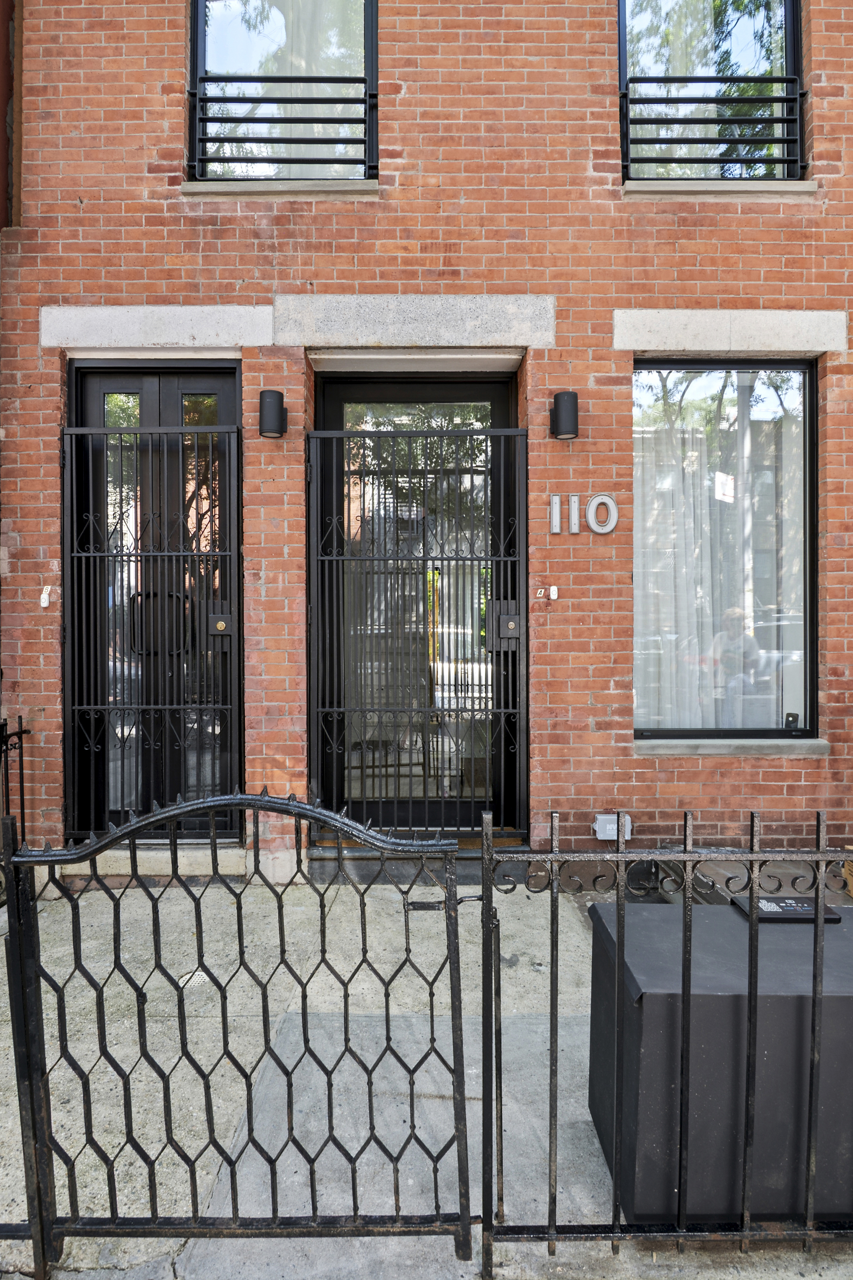 110 Butler Street, Unit 2 Brooklyn, NY 11231 - Photo 8 of 9 a view of a brick house with wooden fence