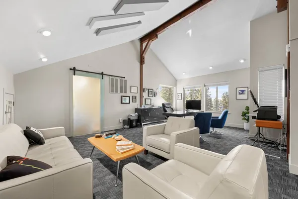 a living room with furniture and a table