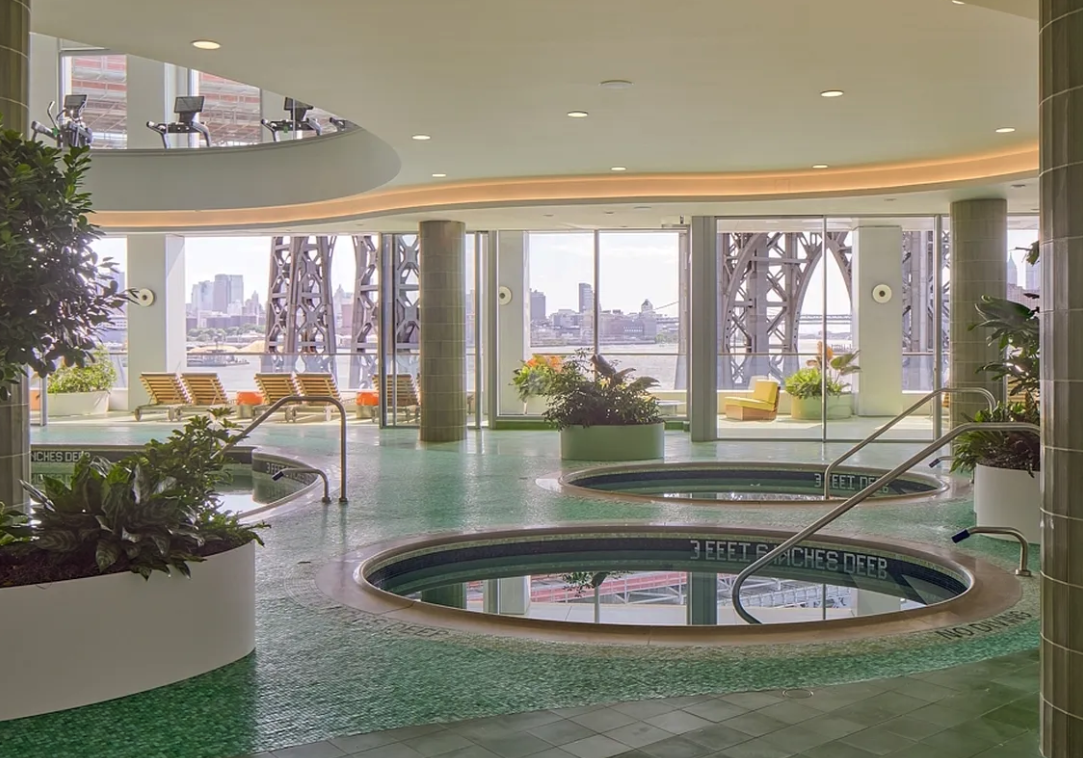 5 South 5th Street, Unit 913 Brooklyn, NY 11249 - Photo 9 of 24 a view of a living room and floor to ceiling window and kitchen