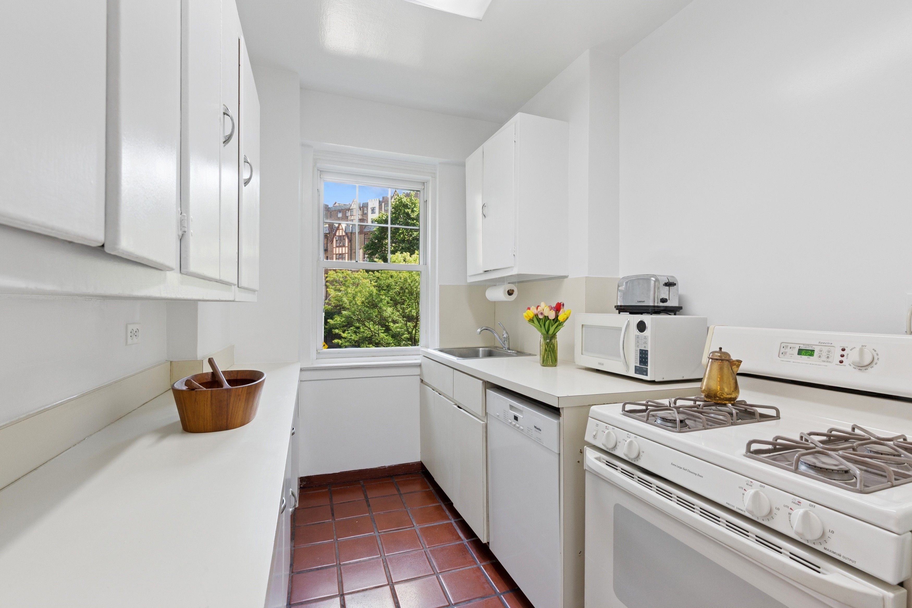 120 Cabrini Boulevard, Unit 48 Manhattan, NY 10033 - Photo 4 of 23 a kitchen with stainless steel appliances granite countertop a sink stove and cabinets