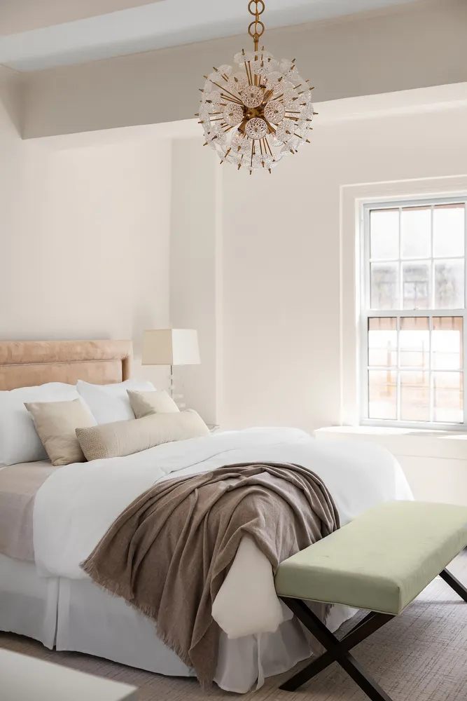 a bedroom with bed and a couch