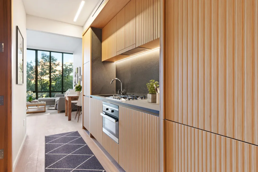 a kitchen with stainless steel appliances granite countertop a refrigerator and a stove