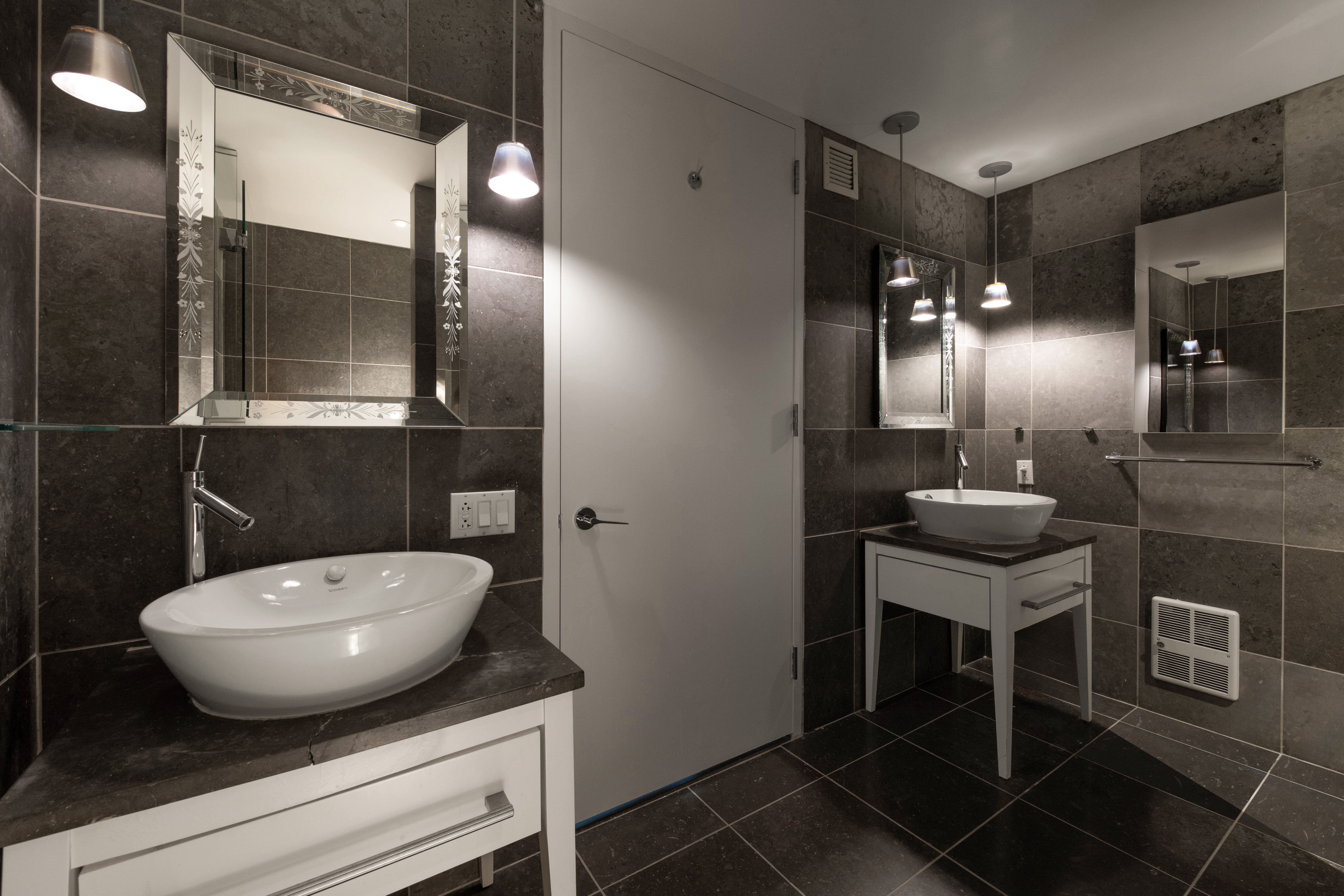 340 East 23rd Street, Unit 4D Manhattan, NY 10010 - Photo 7 of 19 a bathroom with a toilet a sink and mirror