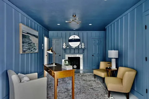 a spacious bedroom with a bed and a window