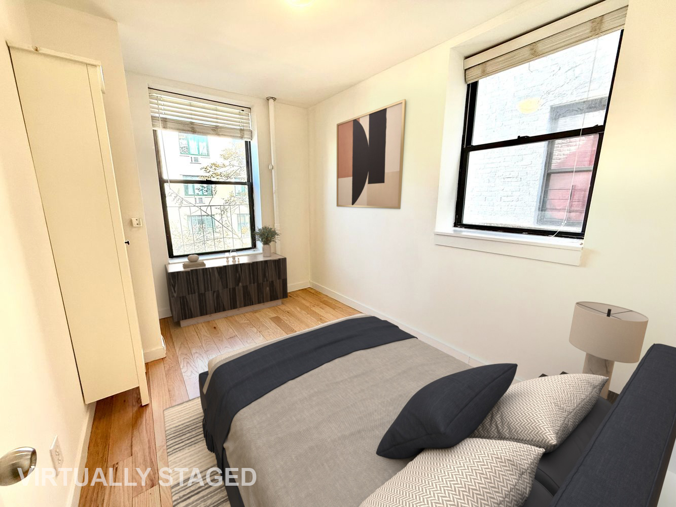 245 West 115th Street, Unit 16 Manhattan, NY 10026 - Photo 2 of 10 a bedroom with a bed and a window
