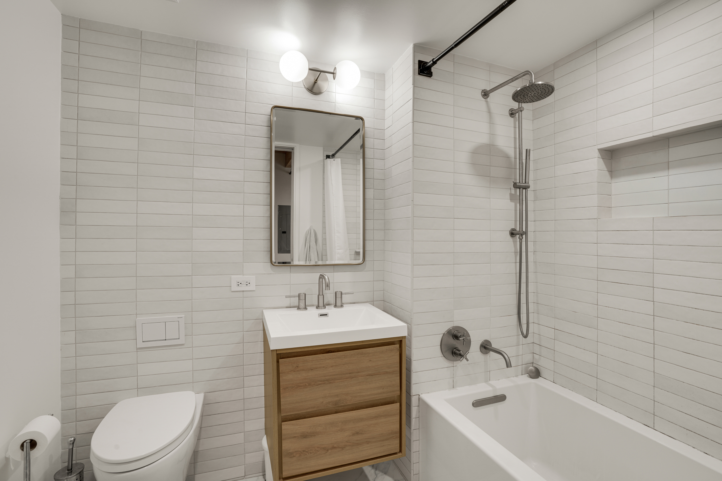 120 Java Street, Unit 1B Brooklyn, NY 11222 - Photo 4 of 12 a bathroom with a sink a toilet and shower